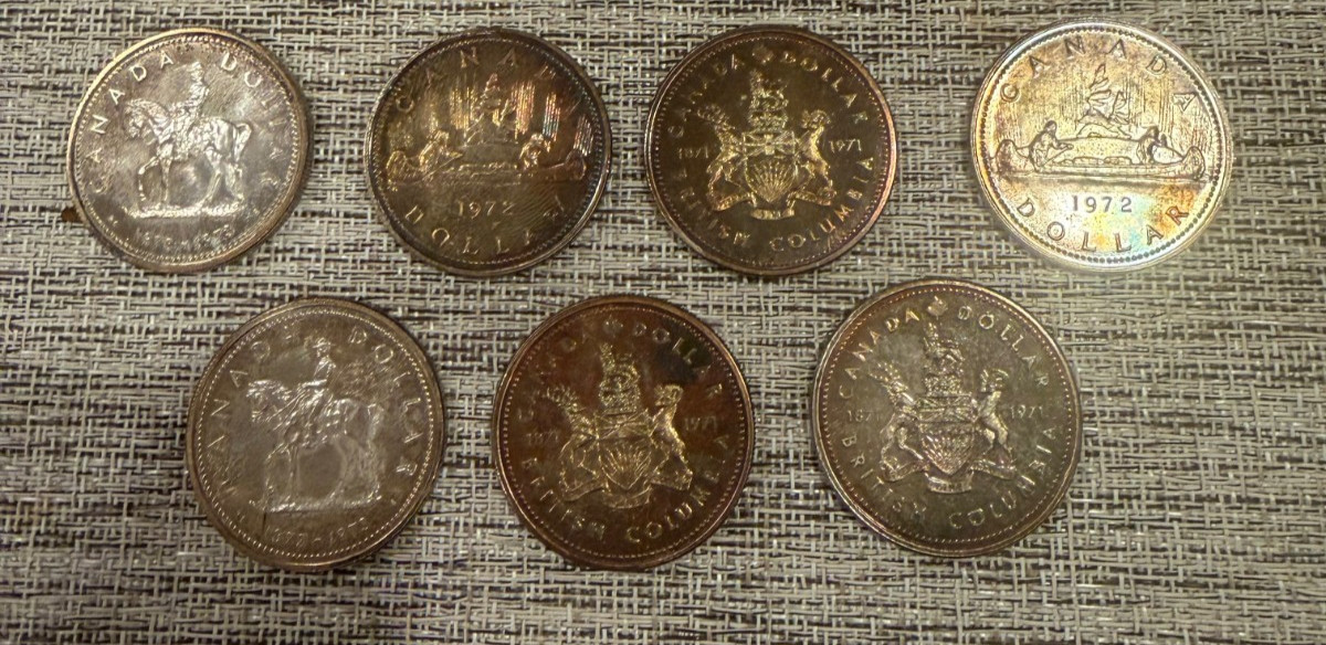 7 Canadian silver dollars totaling  2.625 troy oz silver - *Read Description*