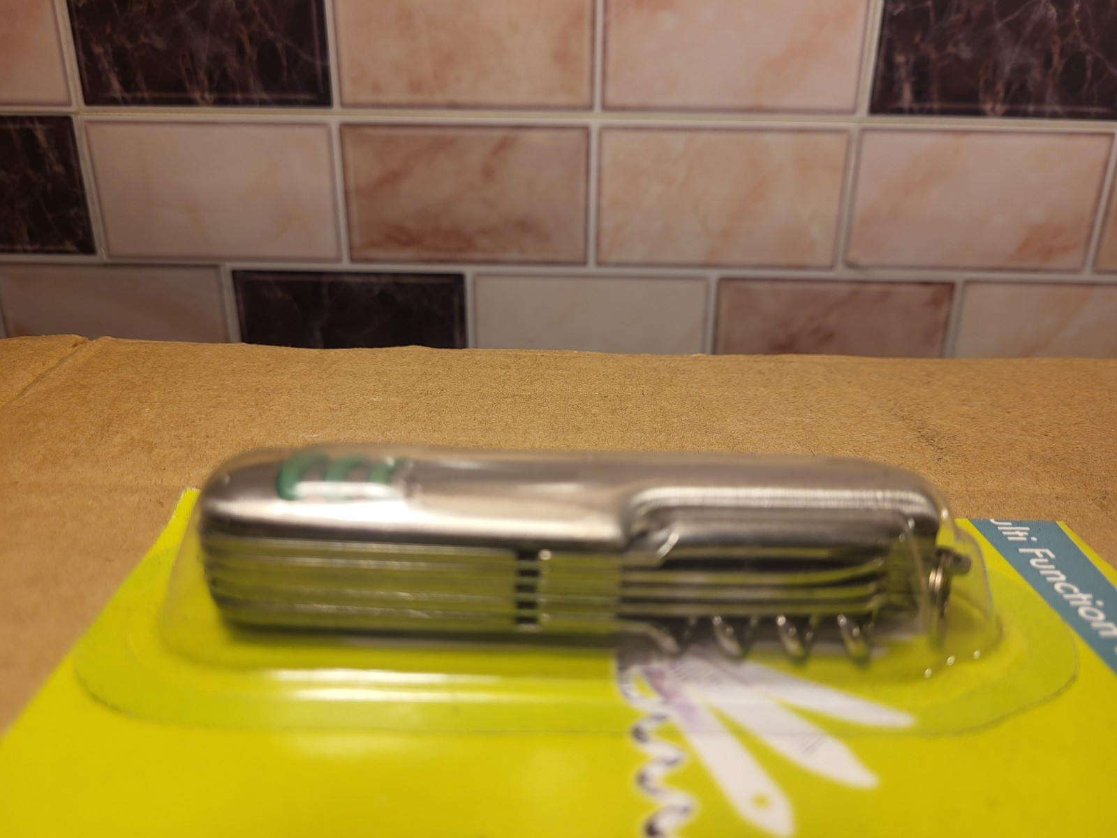 Multi Function Pocket Knife New/Sealed Multitool Silver W/Green Accents 3.5"