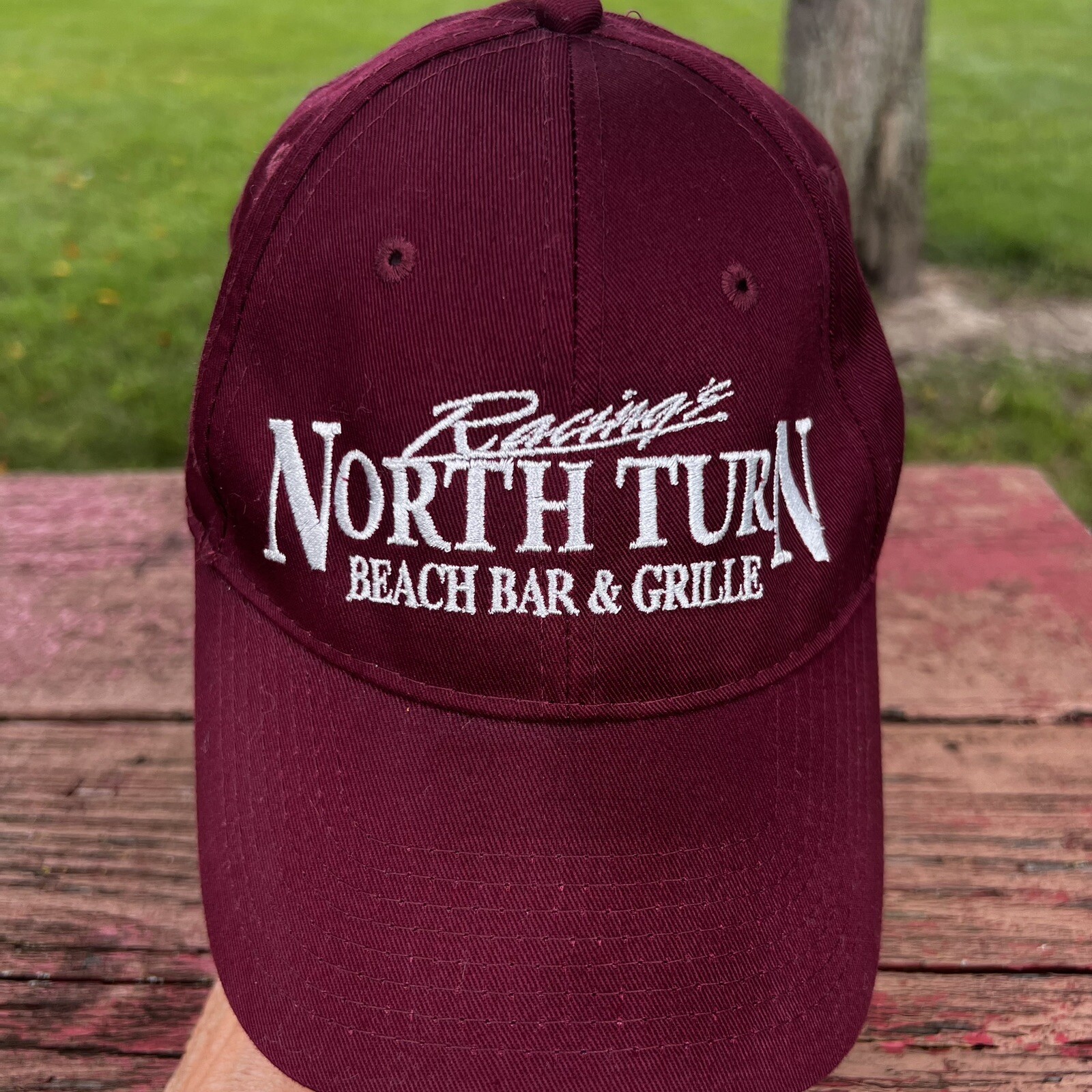 Racings North Turn Beach Bar & Grille in White on Maroon Hat Cap Hook Loop