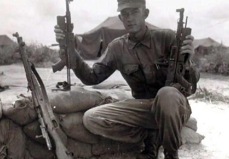 Vietnam  War  Photos --  Soldier With Capture VC Weapons