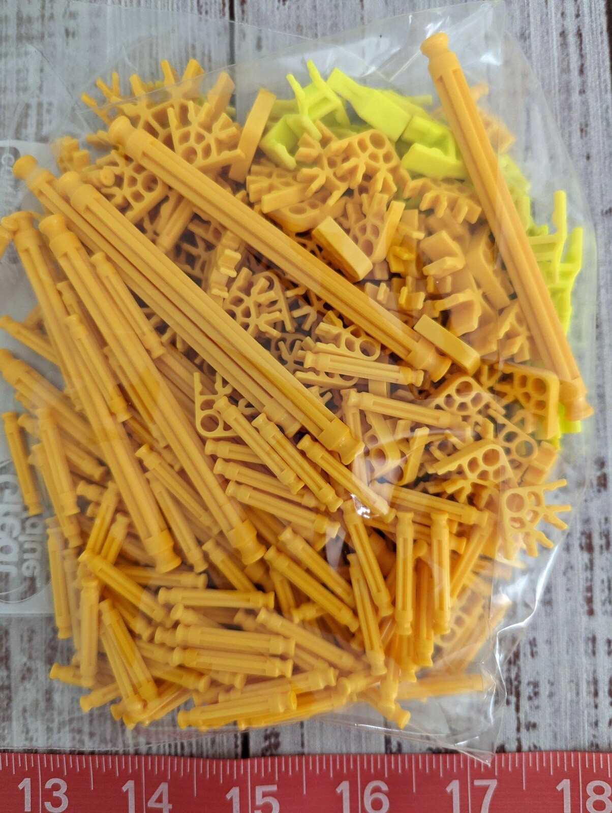 243 Knex pieces yellow connectors, rods, snaps