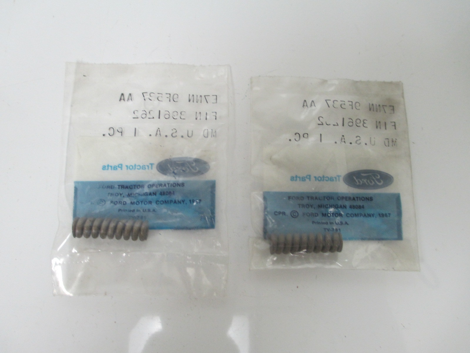 FORD SPRING 2 PACK E7NN9F537AA OEM NEW IN PACKAGE TRACTOR BACKHOE