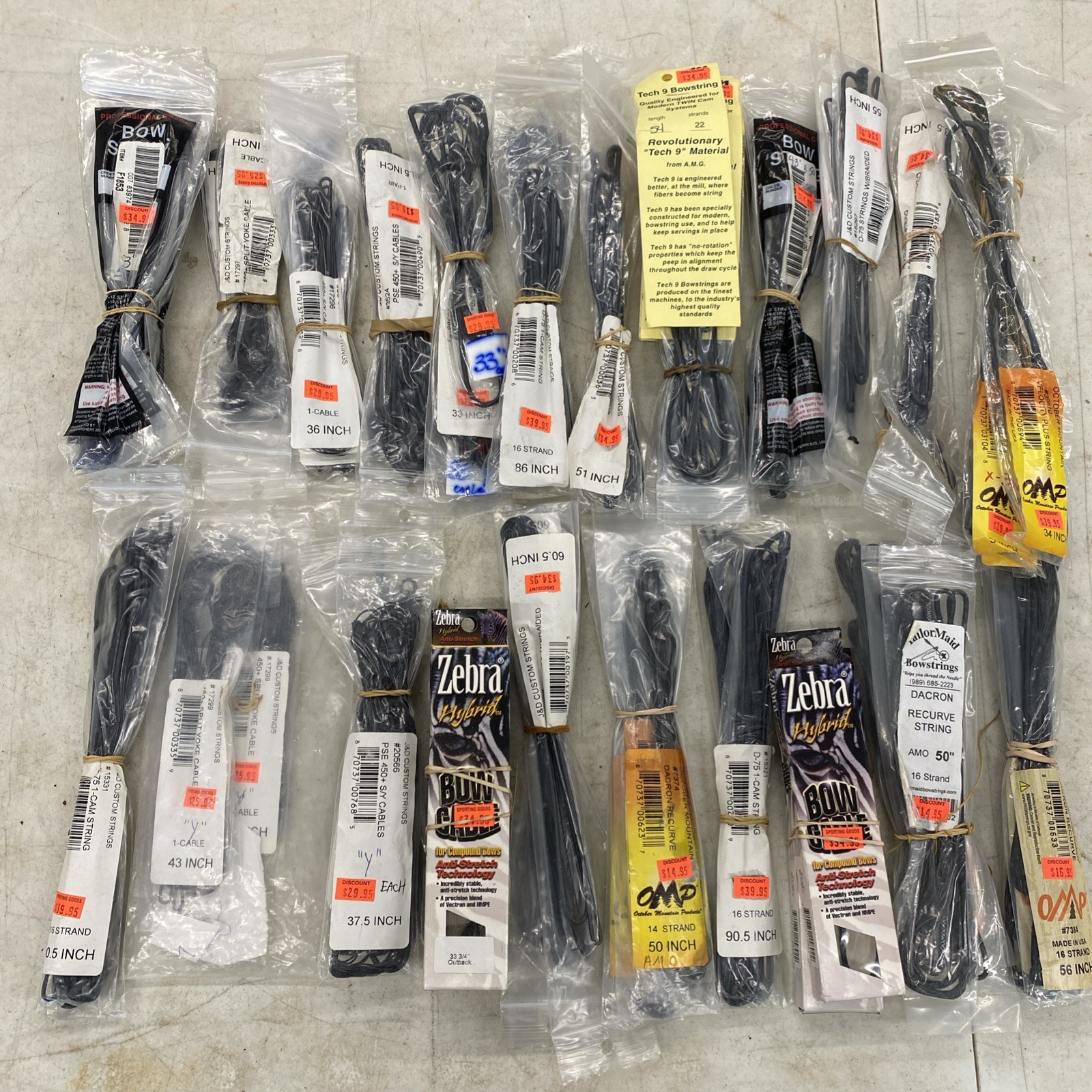 RESALE OPPORTUNITY: Lot Of 70+ Bowstrings Mostly New!, Zebra, OMP, J&D etc M0722