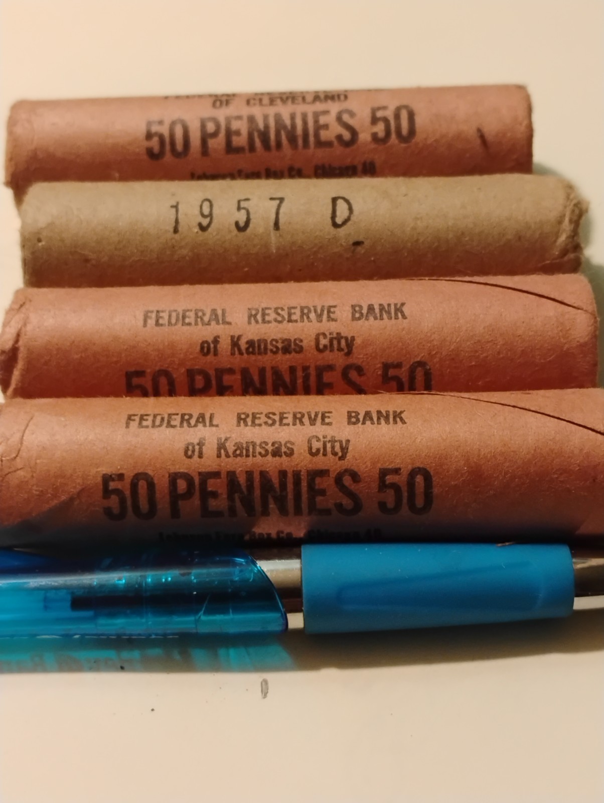 1957d uncirculated penny roll of 50 coins pulled from any of wrappers in photo