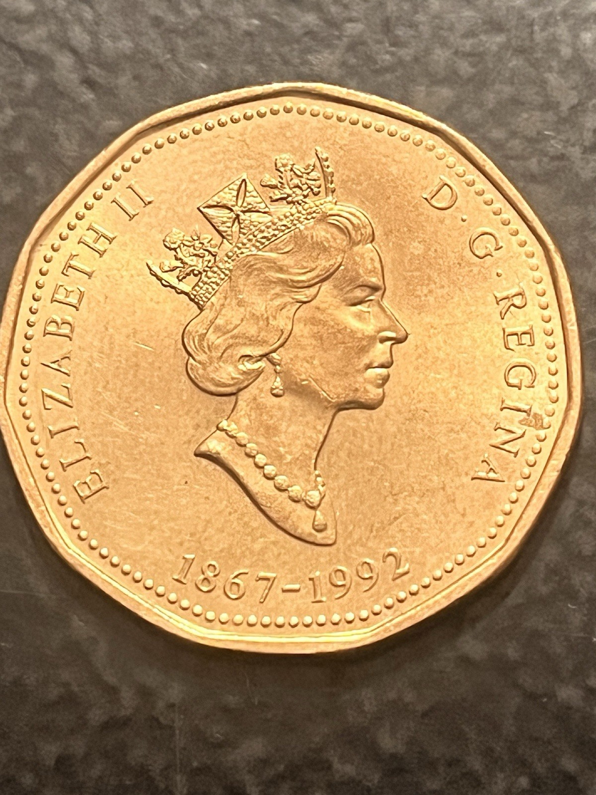 1992 Canadian $1 coin, commonly known as a "Loonie". commemorative issue 125th