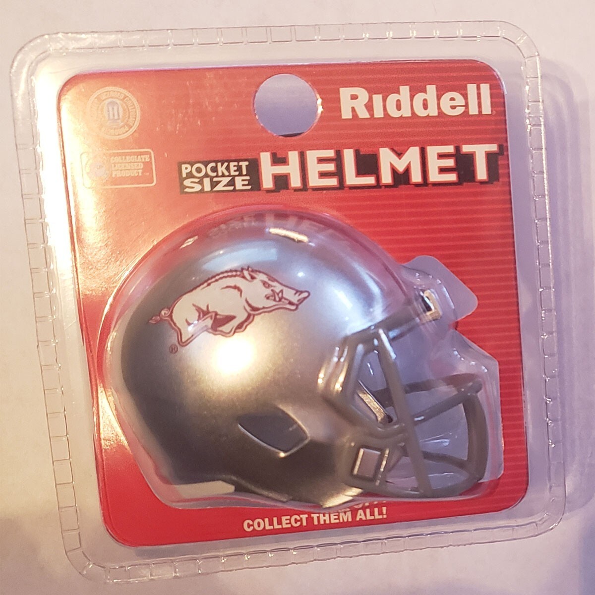 Arkansas Razorbacks Silver Riddell Speed Pocket Pro Helmet in Clam Shell