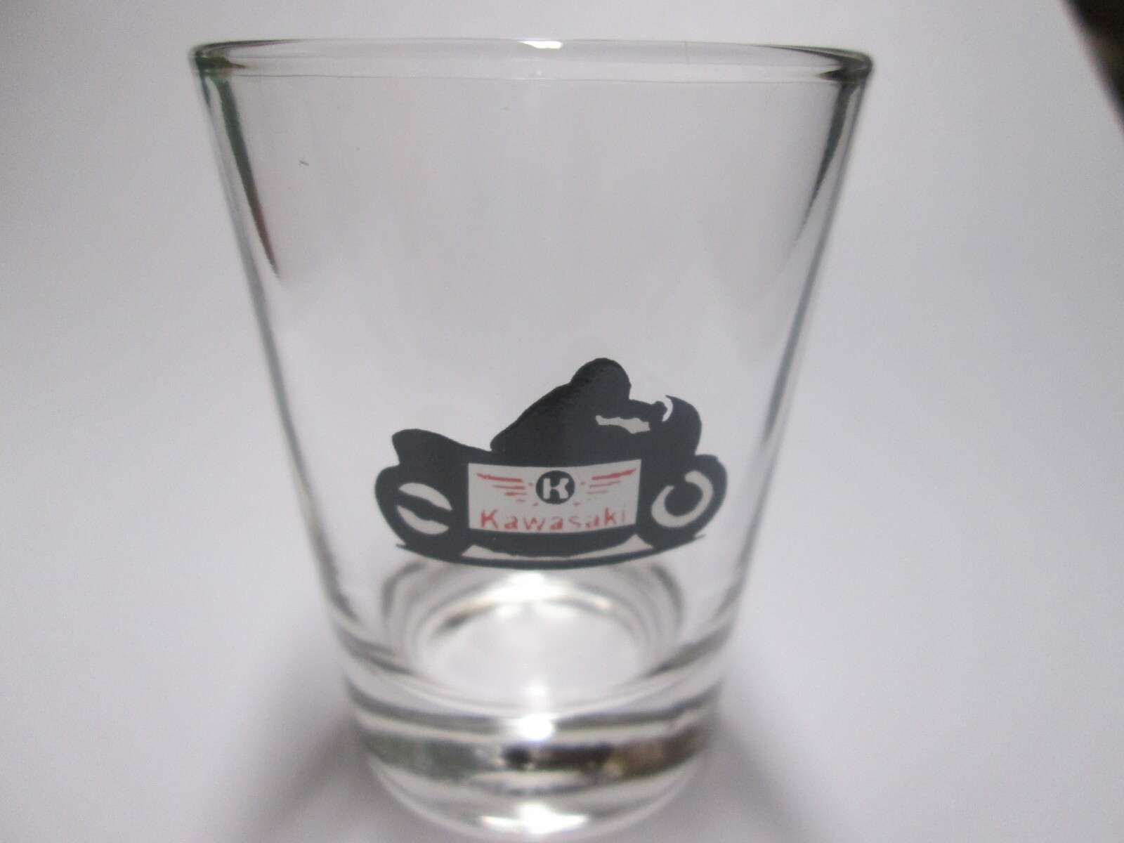 KAWASAKI MOTORCYCLES LOGO ON A CLEAR SHOT GLASS