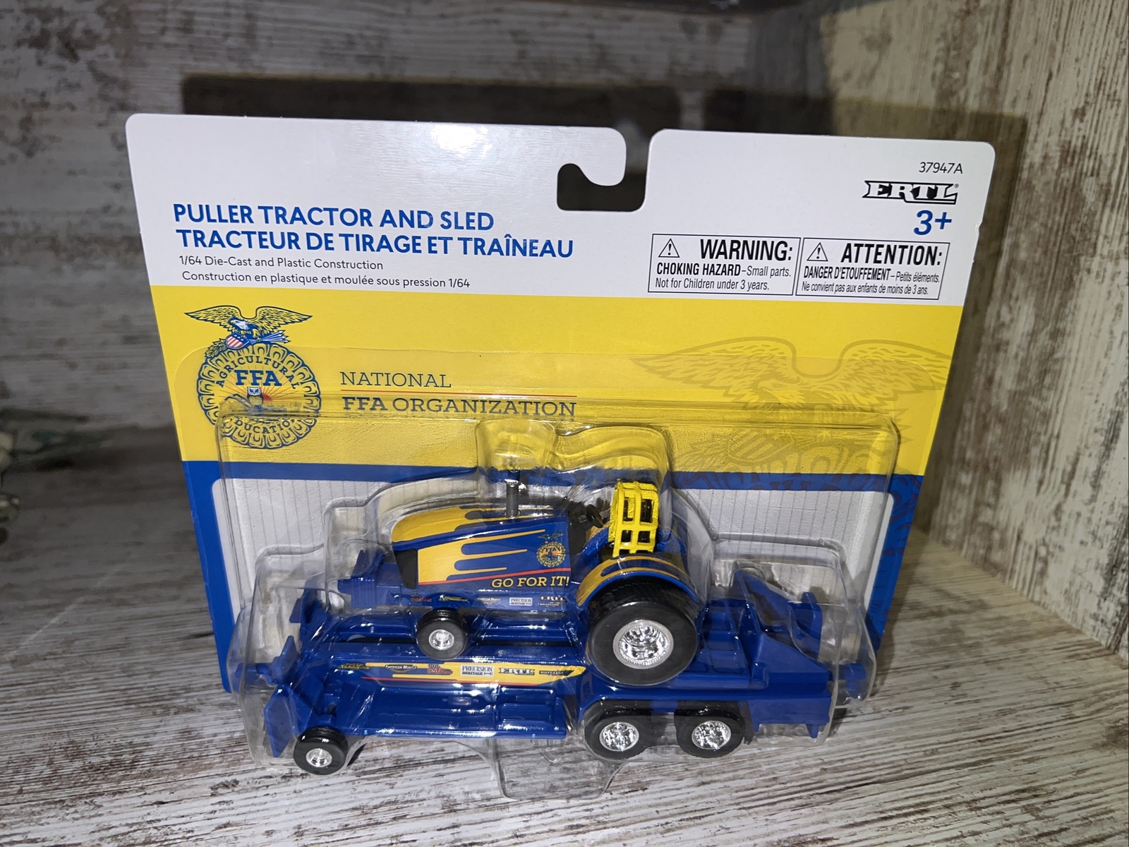 1/64th Scale New Holland  FFA Edition Go For It Puller Tractor And Sled Die Cast