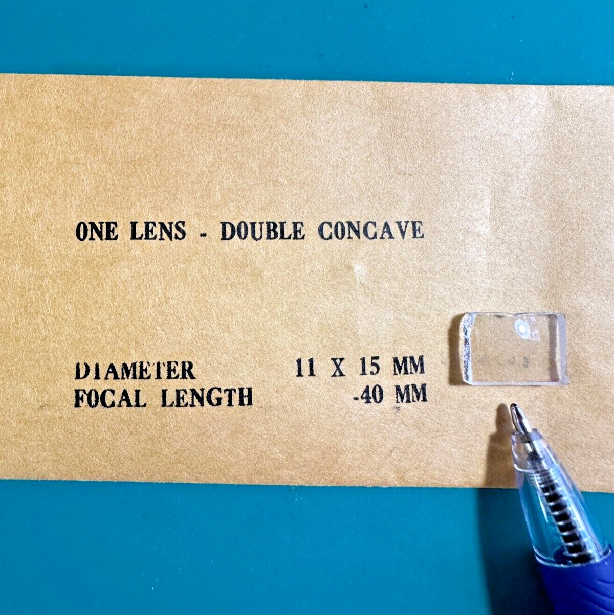 Edmund One Lens Double Concave 11mm x 15mm Diameter -40 Focal Length *Chipped*