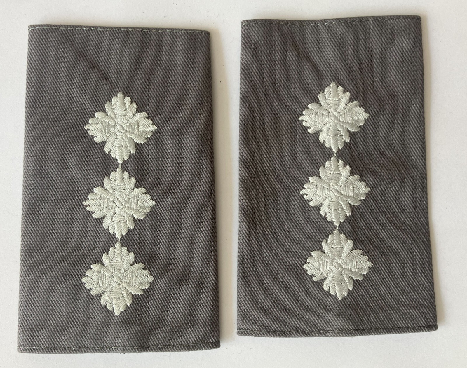 British Army Captain rank shoulder slides, unusual design and colour