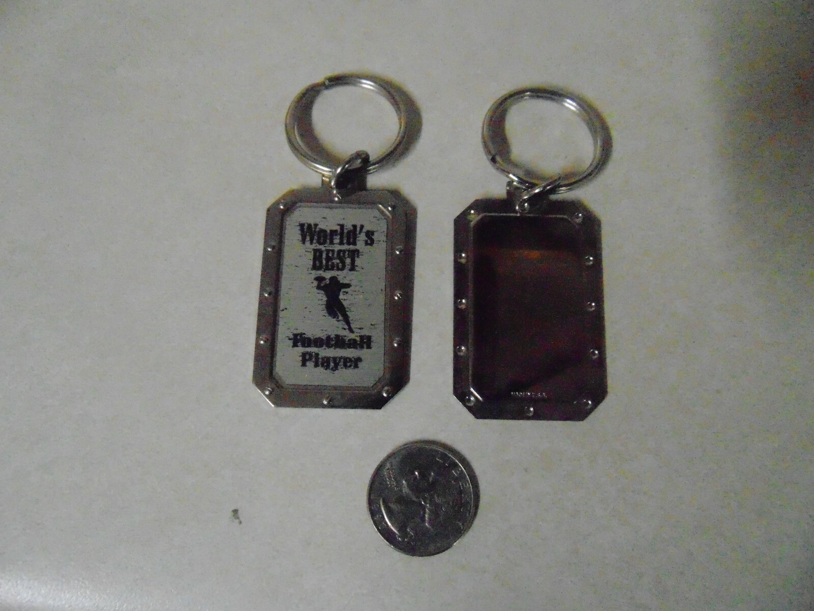DOG TAG SHAPED KEY CHAIN WORLDS BEST FOOTBALL PLAYER ABOUT 2 INCHES
