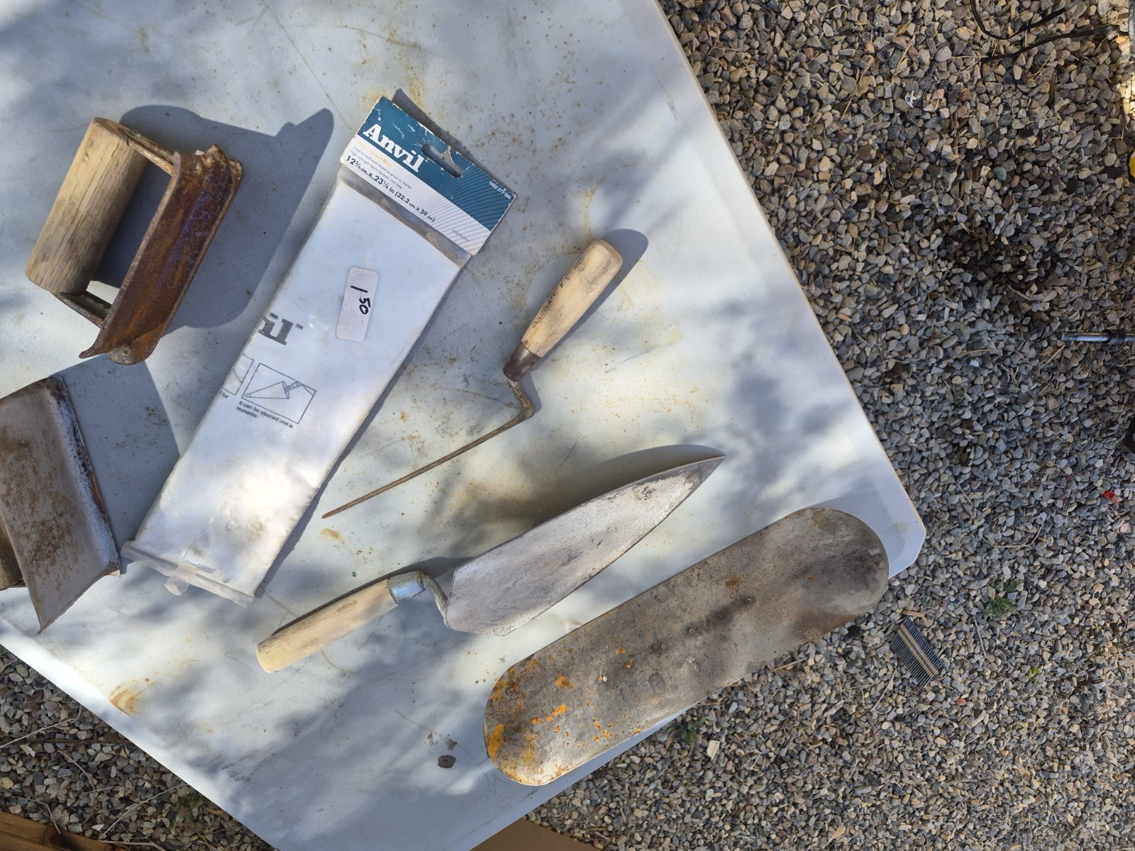Masonry Tools And Notched Towels