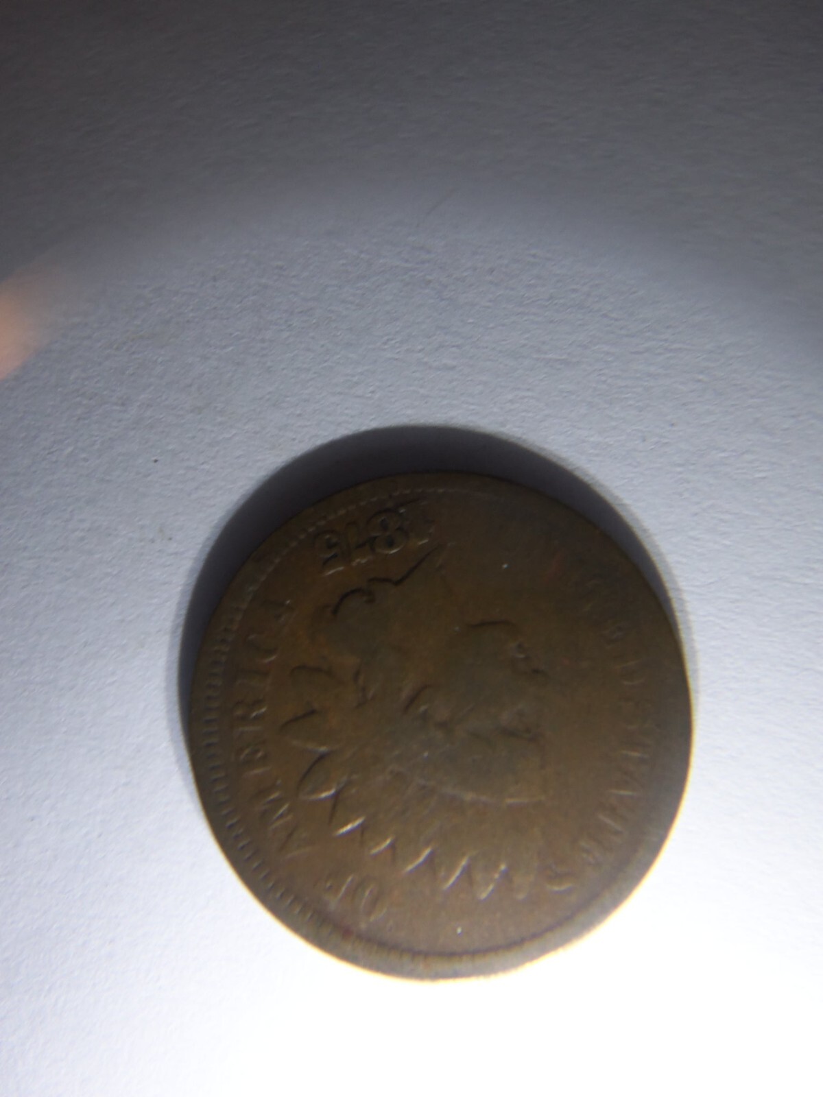 A KEY 1875 INDIAN HEAD PENNY