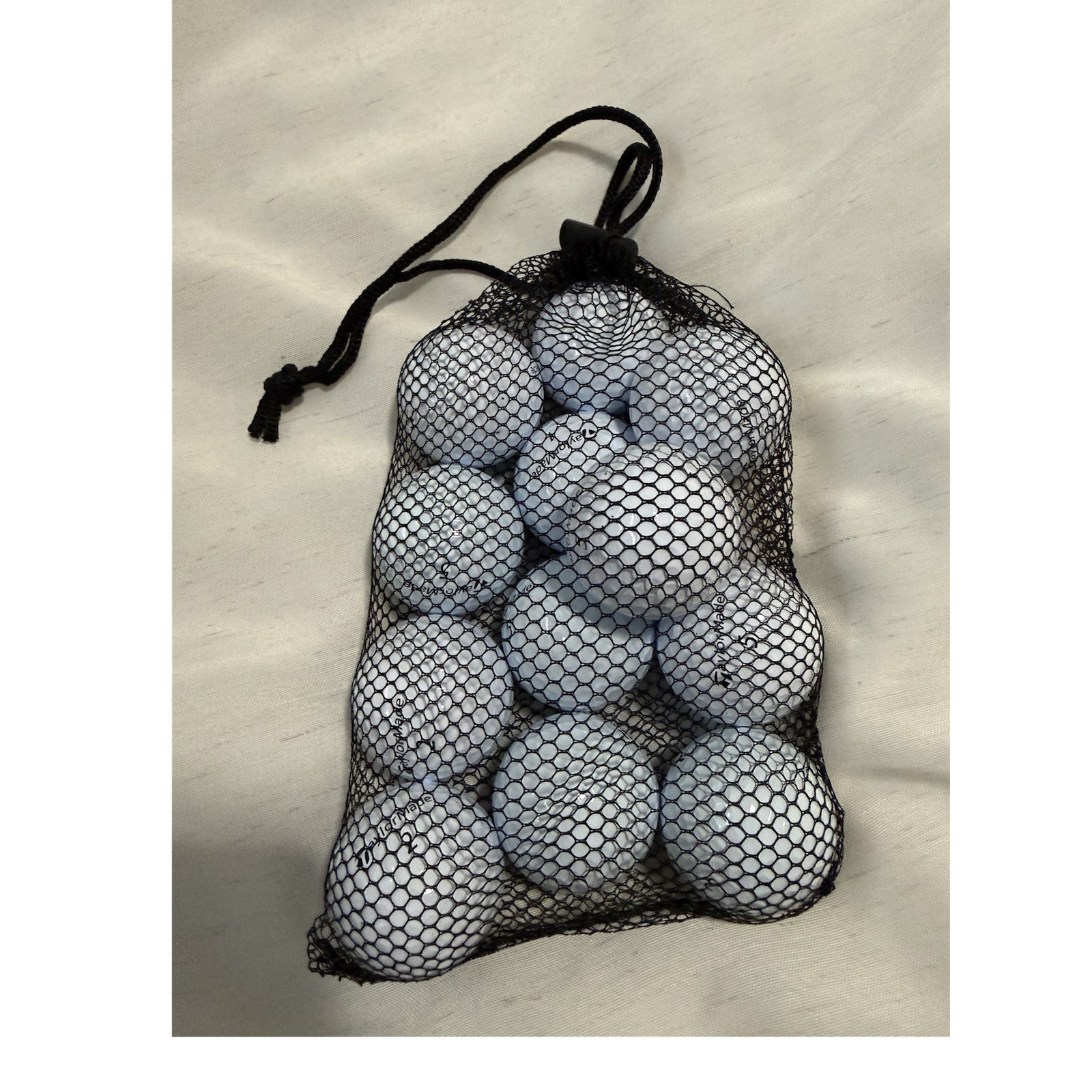TaylorMade TP5 5AAAAA White Golf Balls 12 Pack in mesh bag.