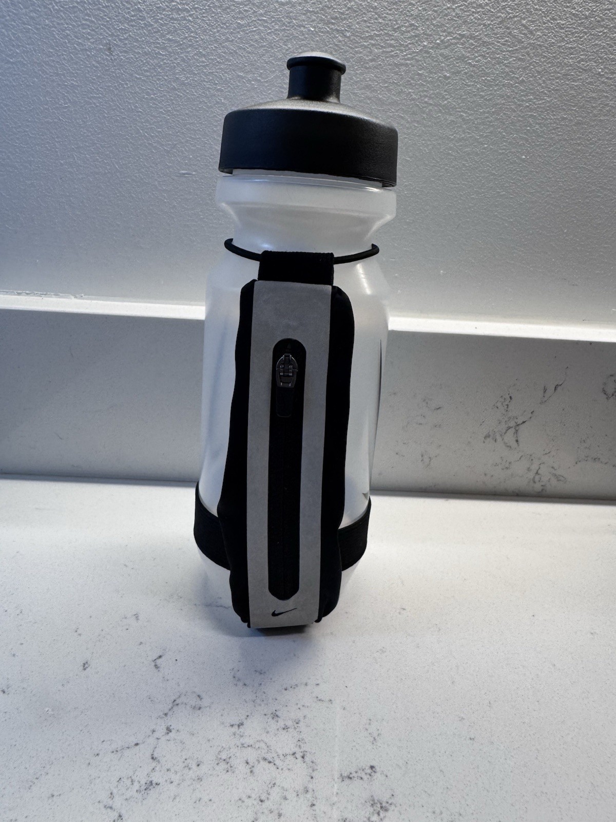 Nike Stride 22 oz Handheld Water Bottle – Black/White with Storage Pocket