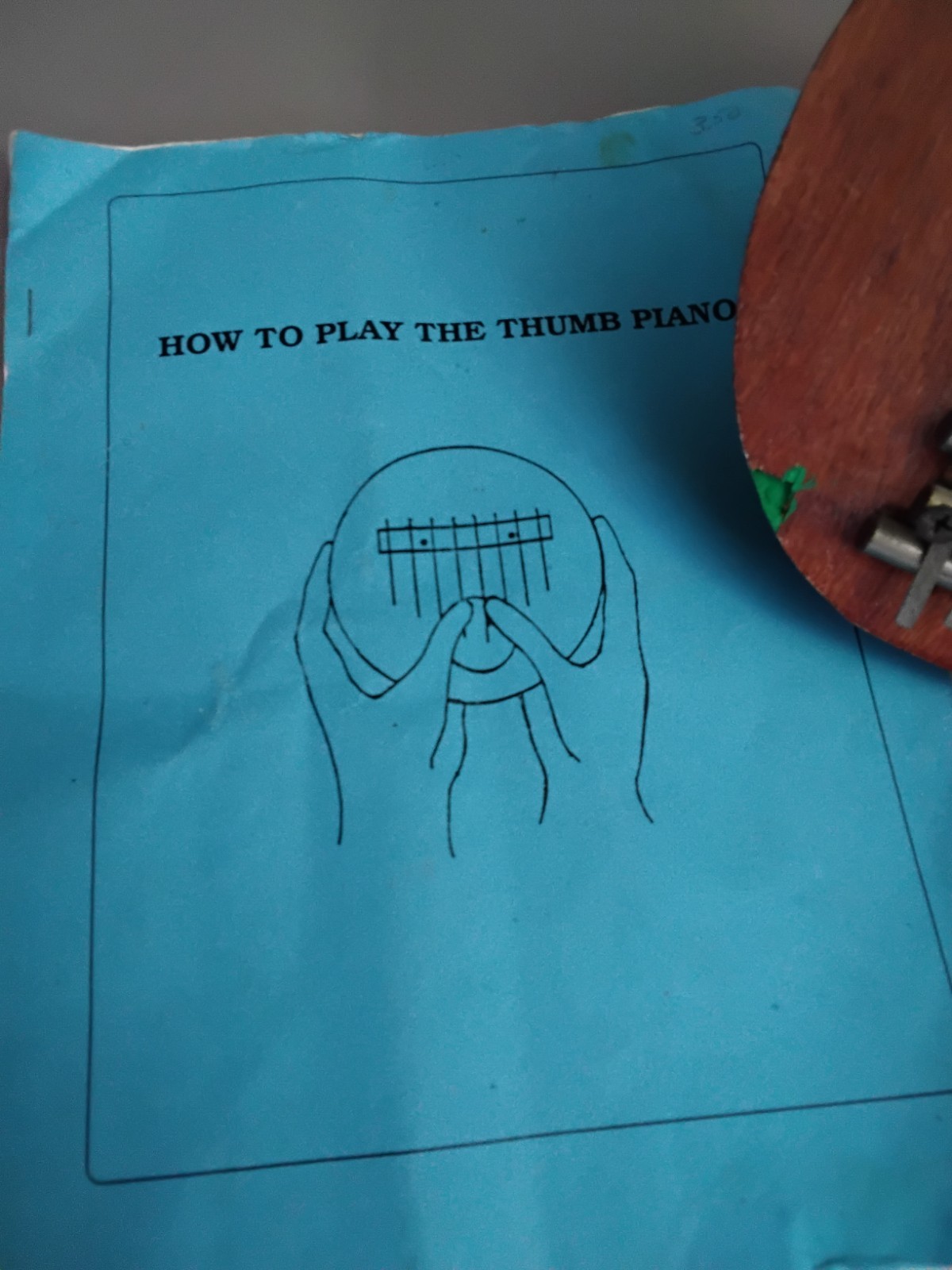 Half Coconut Thumb Piano With Learners Guide.