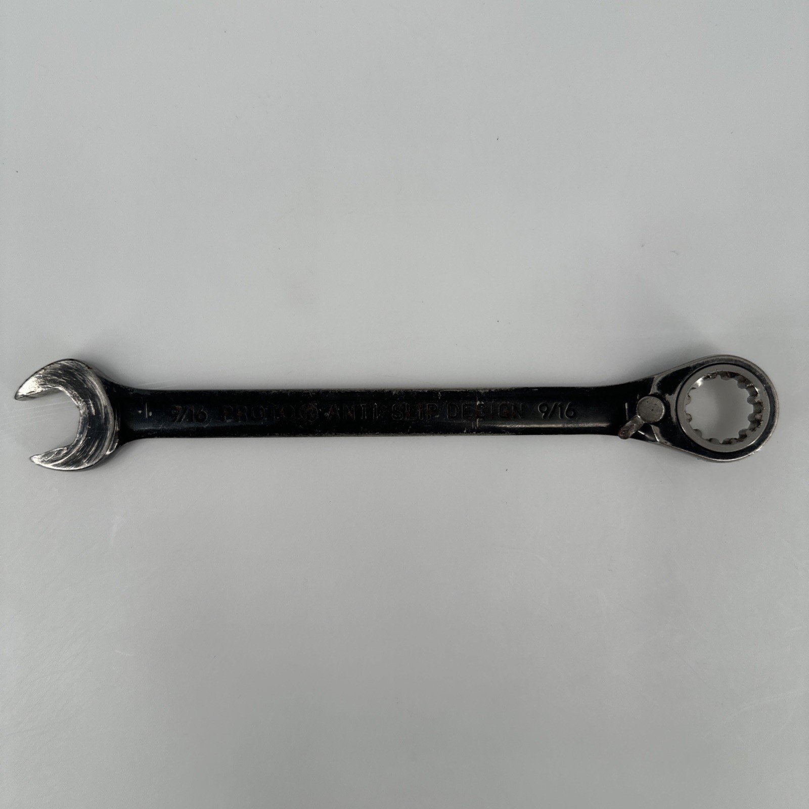 Proto Ratchet Combination Wrench Imperial 9/16 in. Reversing Lever Black Worn