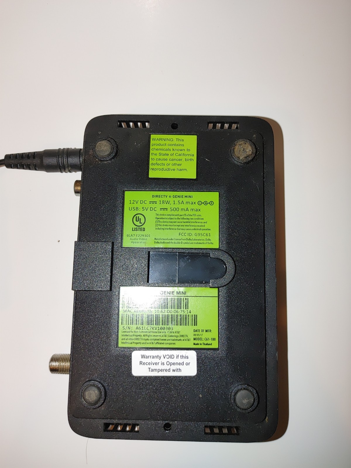 DIRECTV Genie Mini client receiver, model C61-100, with power adapter.