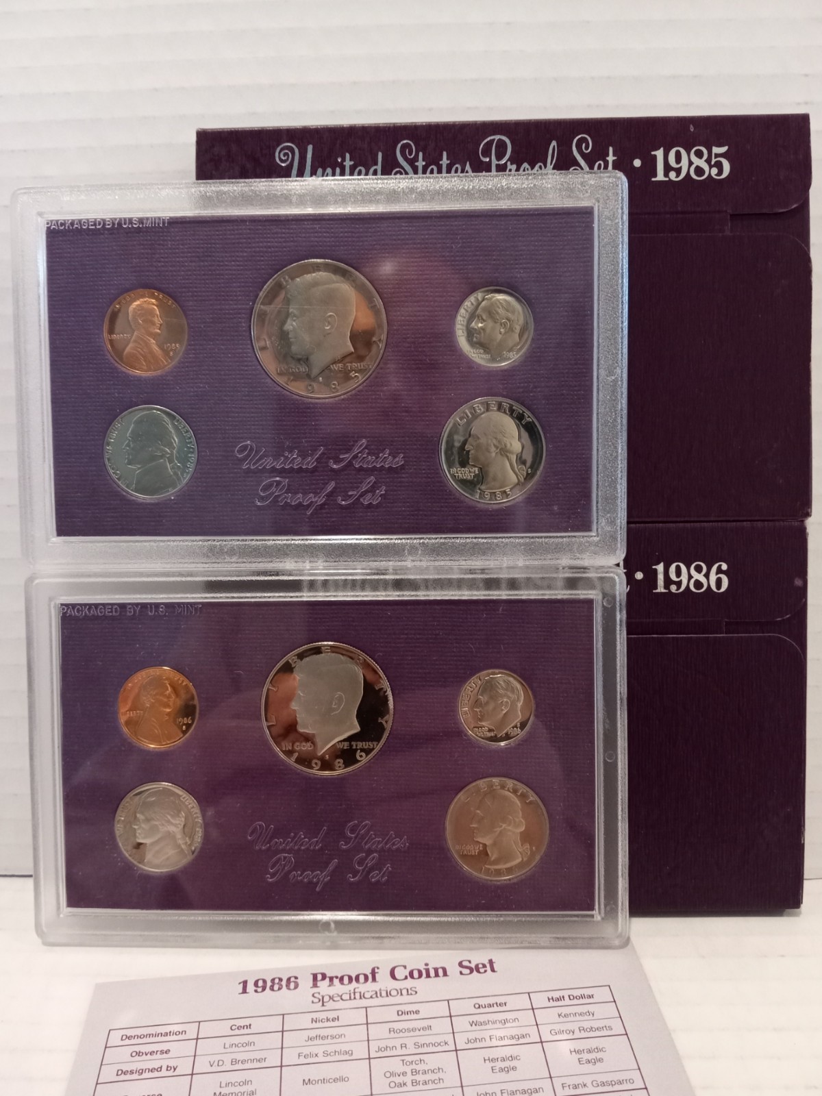 LOT OF TWO - 1985 + 1986 UNITED STATES PROOF SETS WITH OGP BOXES - MINT