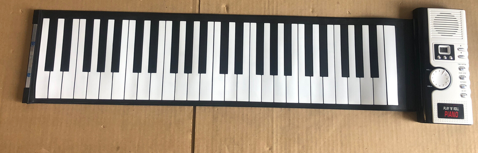 GREAT SHAPE The Sharper Image Play 'N' Roll Digital Piano With Storage Case