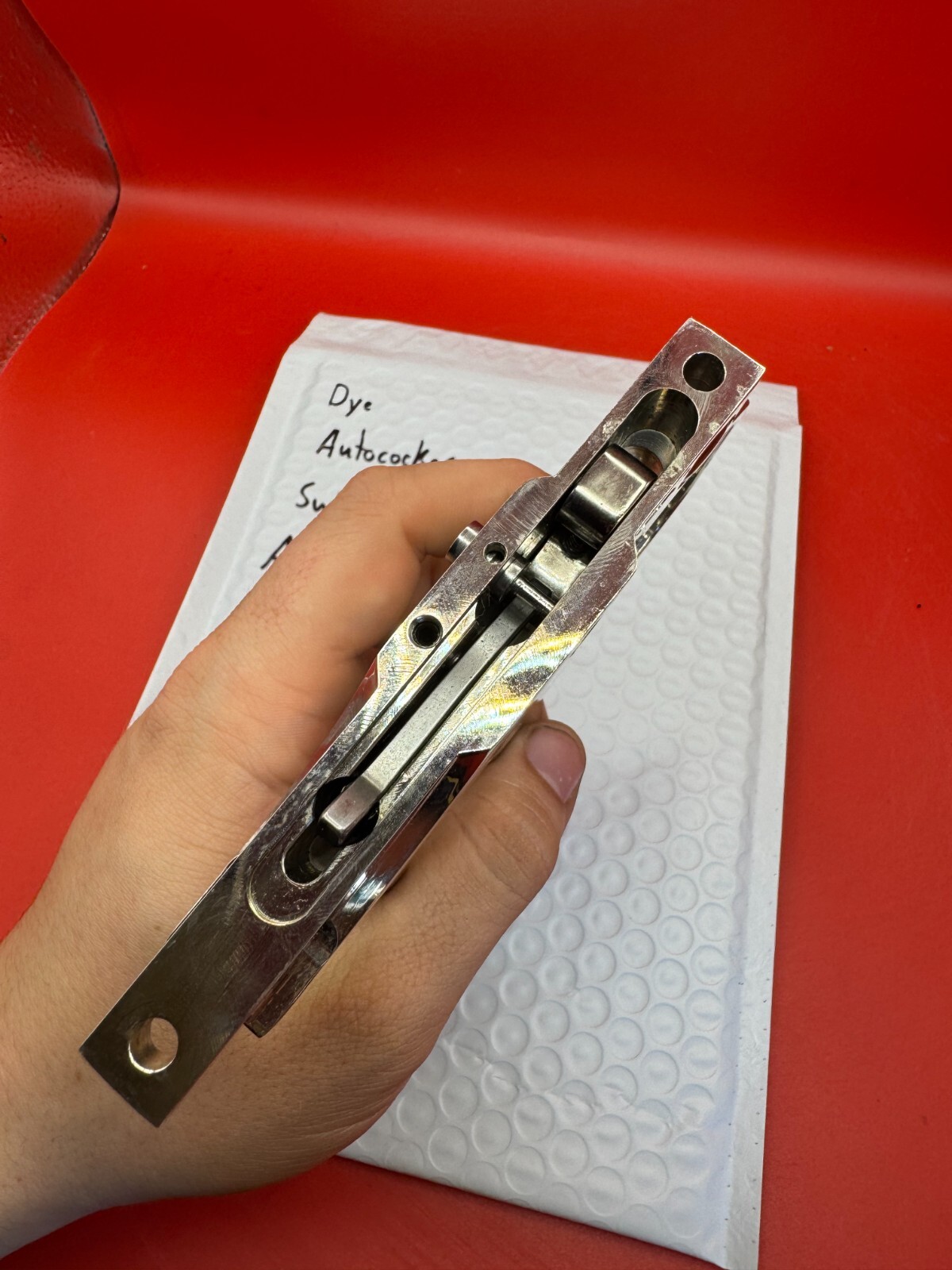 Dye Autococker Swing Frame