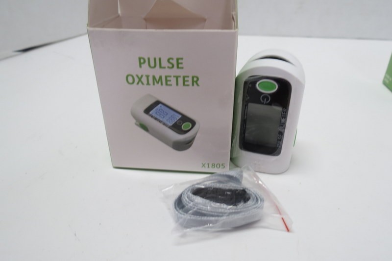 Pulse Oximeter X 1805, in original box with instructions and straps