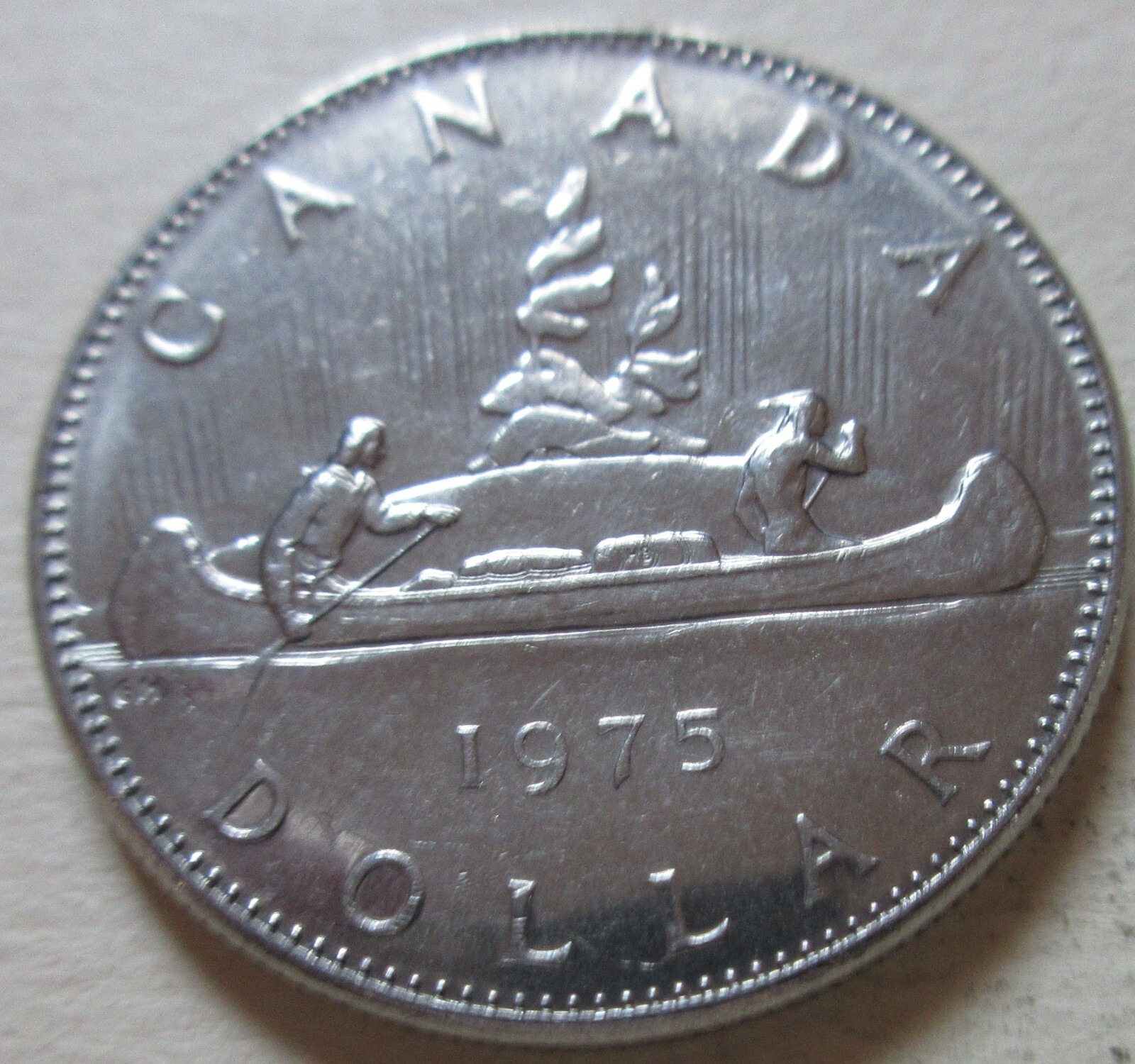 1975 Canada Voyageur Nickel One Dollar Coin. $1