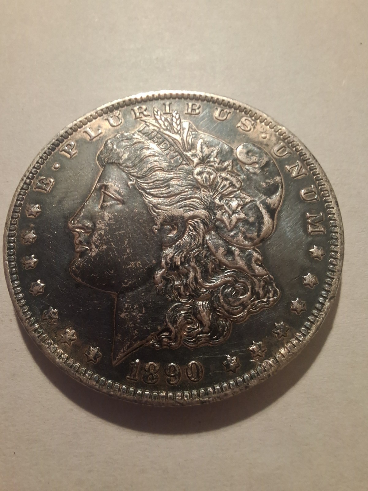 1890-O Morgan Silver Dollar  Raw AU Deep Obverse Toning / Reverse Brilliant