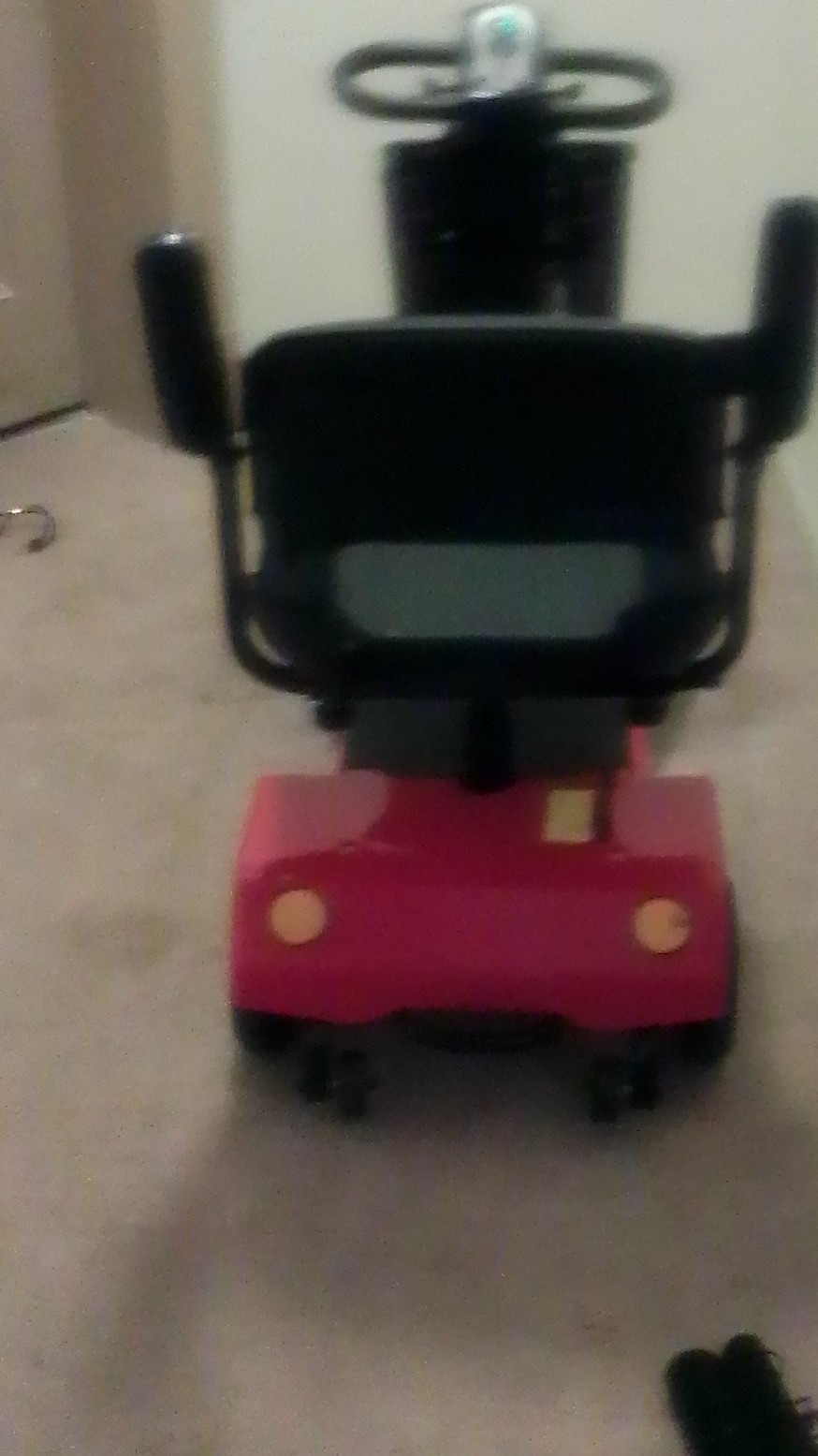 Red 4-Wheeled Mobility Scooter with Basket and Padded Armrest