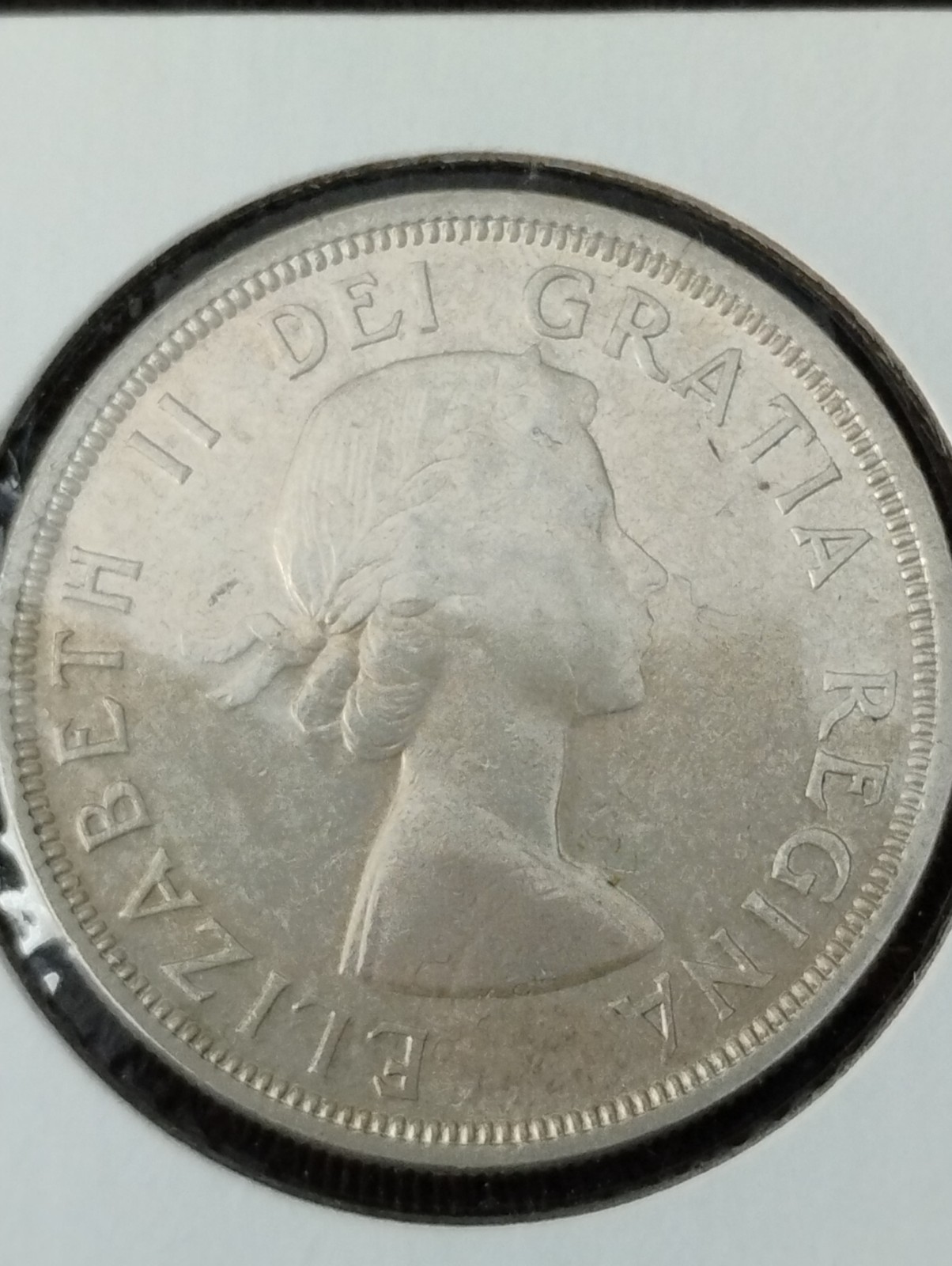 1955 Canada 1 dollar. Arn with die break