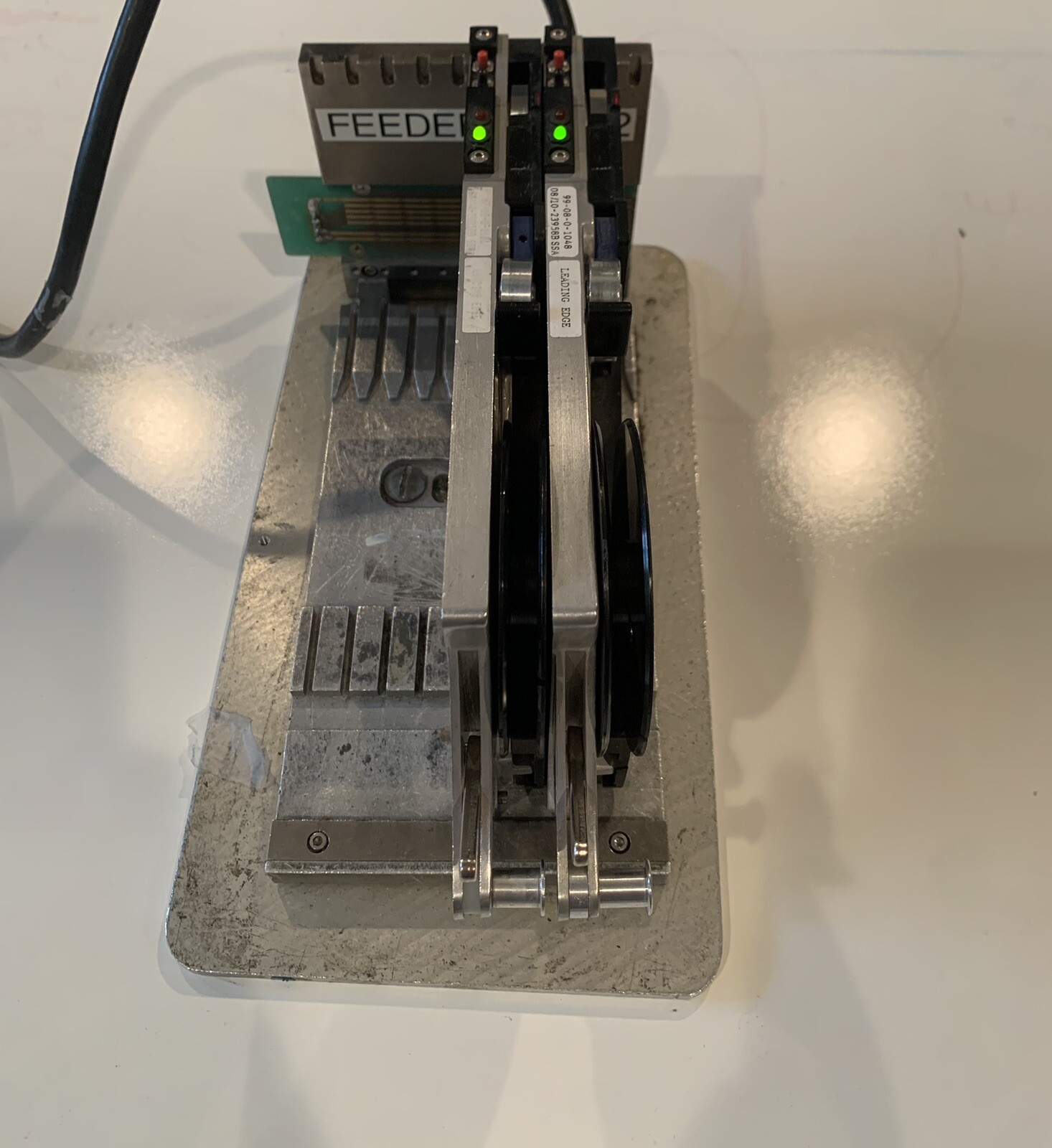 Quad 8MM IQ tape feeders with reel arm. Refurbished by PPM. Fully functional