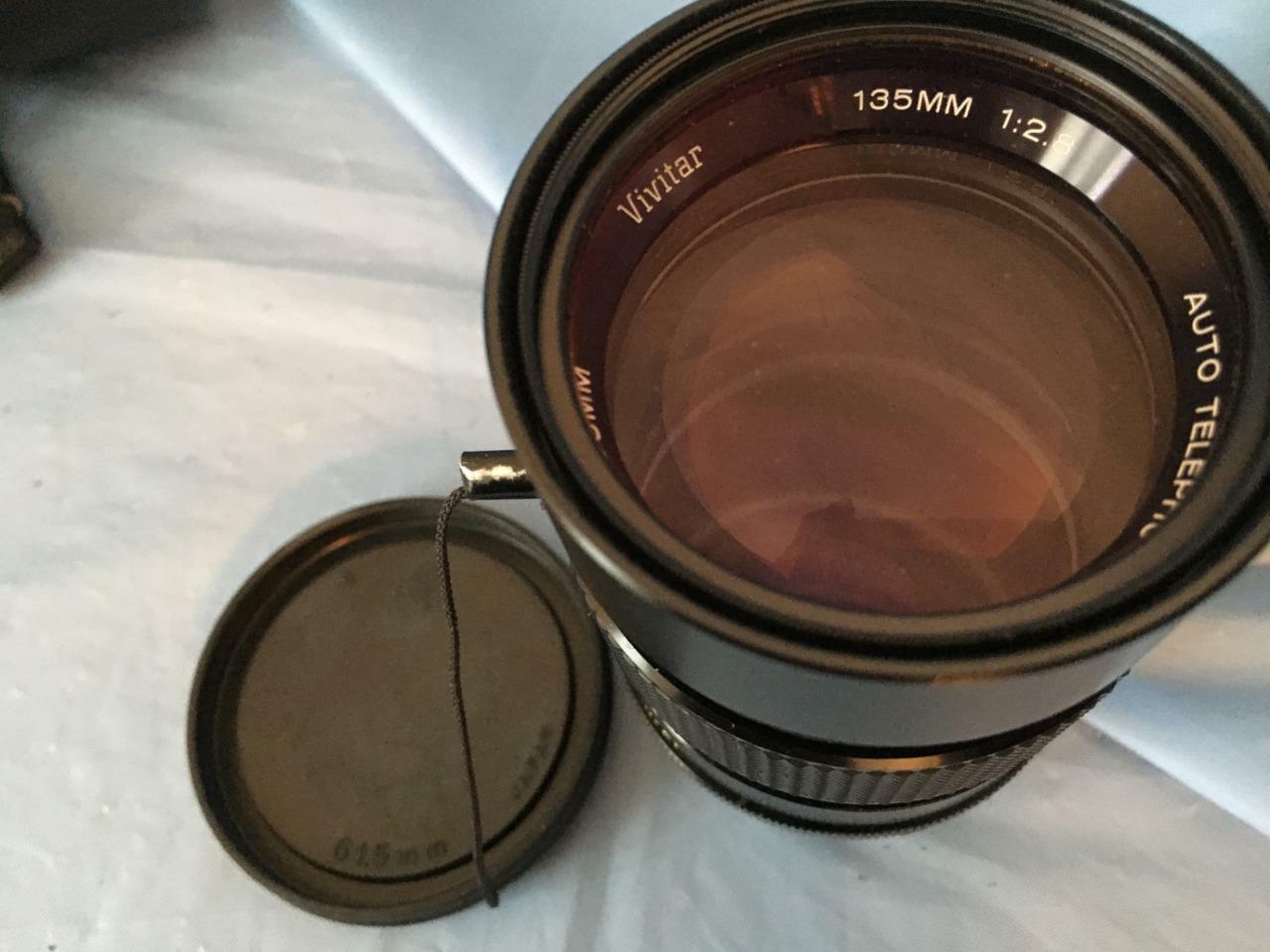 Vivitar telephoto lens + R M C Tokina lens + variety of lens' filters etc.+++++