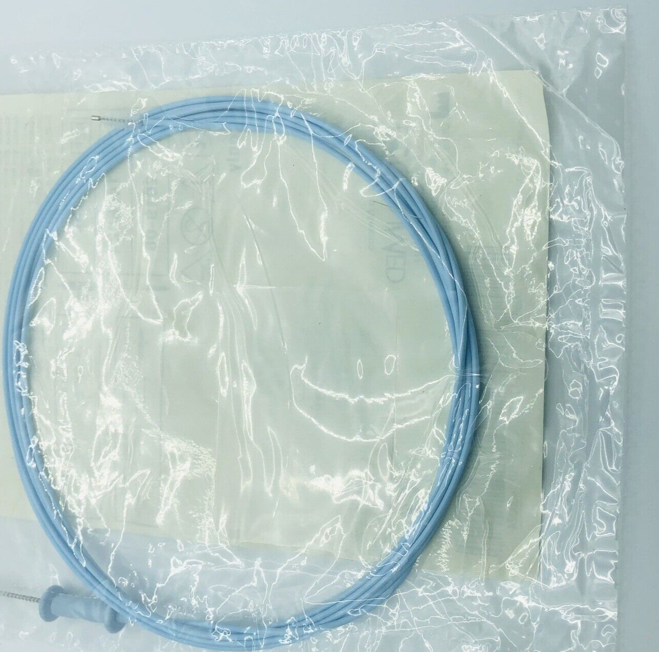 One BLUE DISPOSABLE SCOPE VALVE + CHANNEL CLEANING BRUSH