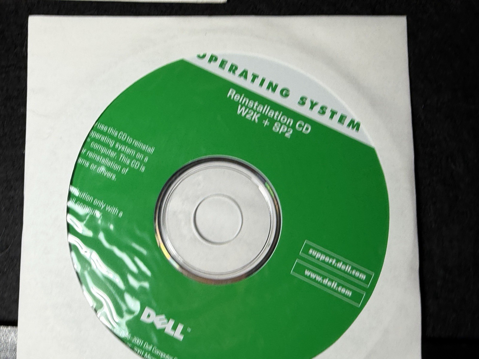 three vintage Dell reinstall CDs