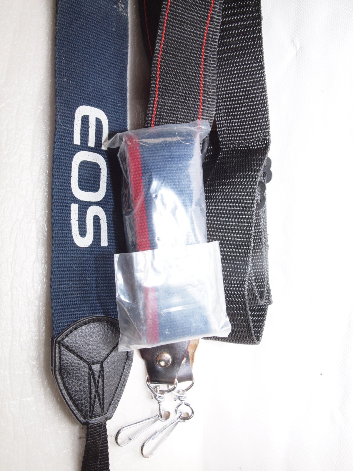 Canon camera straps- 1 new in package includes Canon EOS wide strap.