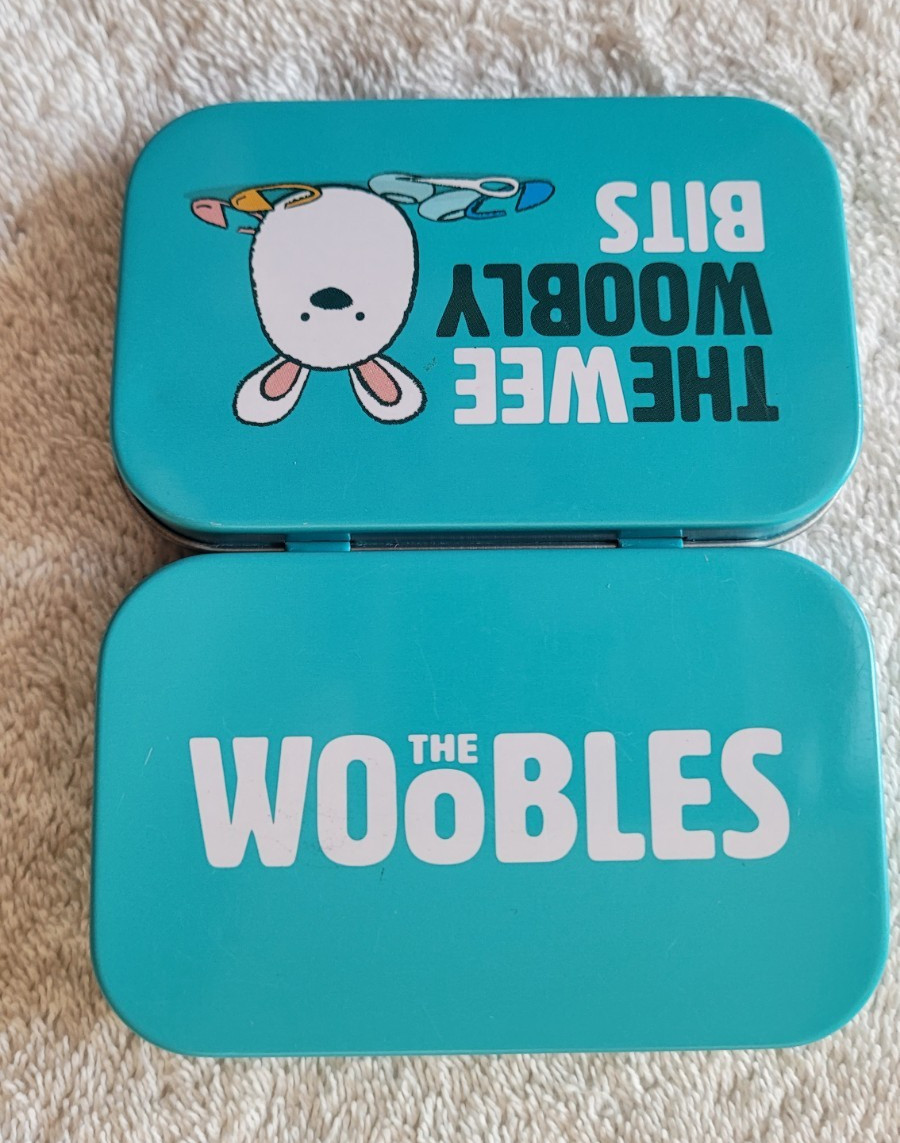 Preowned Wooble Wee Woobly Bits Tin