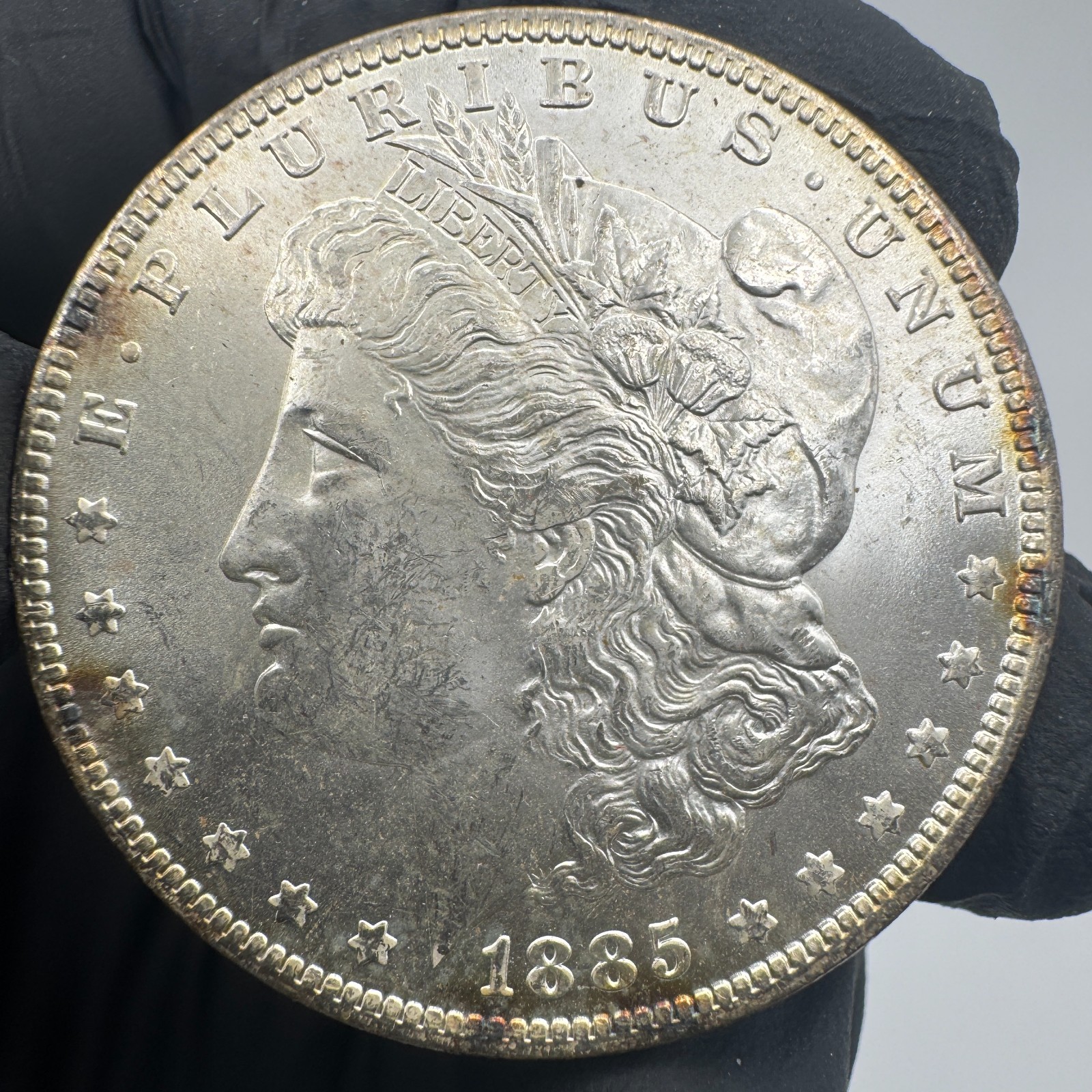 1885-O Morgan Silver Dollar Unc / Toned Side BU Side 14648