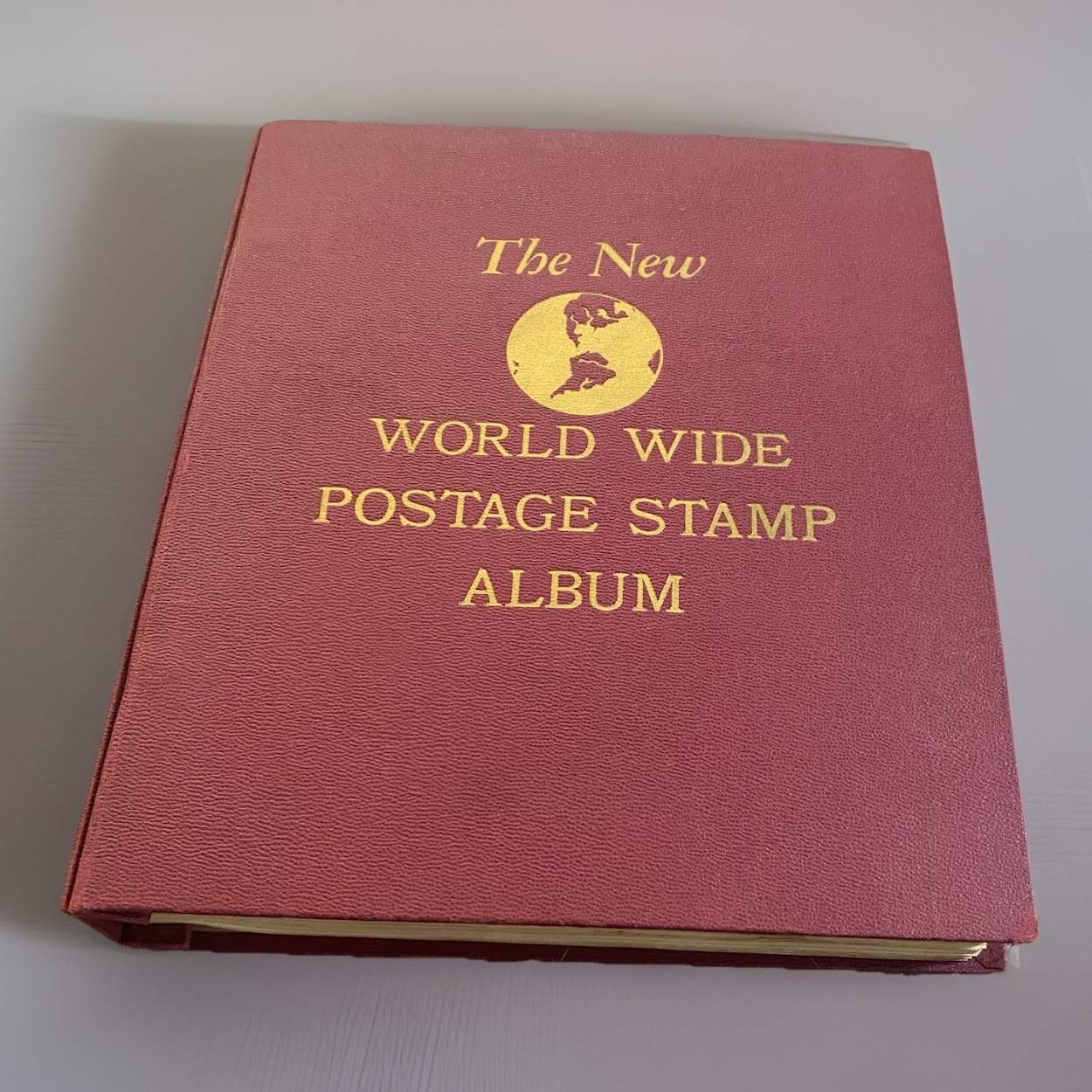 The New World Wide Postage Stamp Album With 2,300+ Stamps Both New & Cancelled
