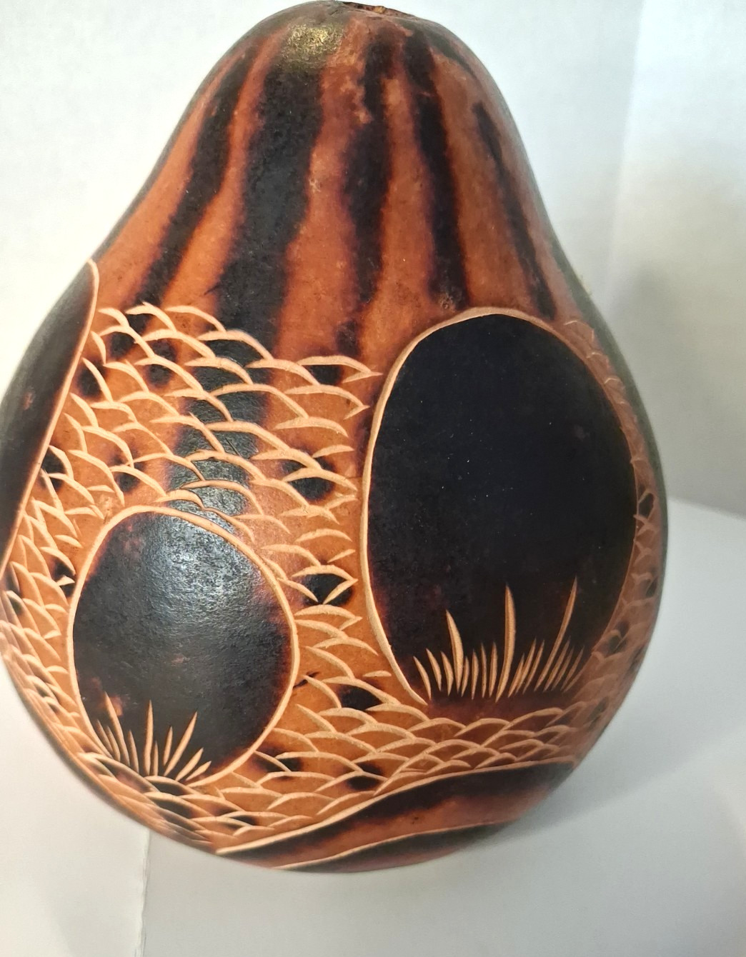 Hand - painted and etched Peruvian gourd rattle with traditional folk-art design