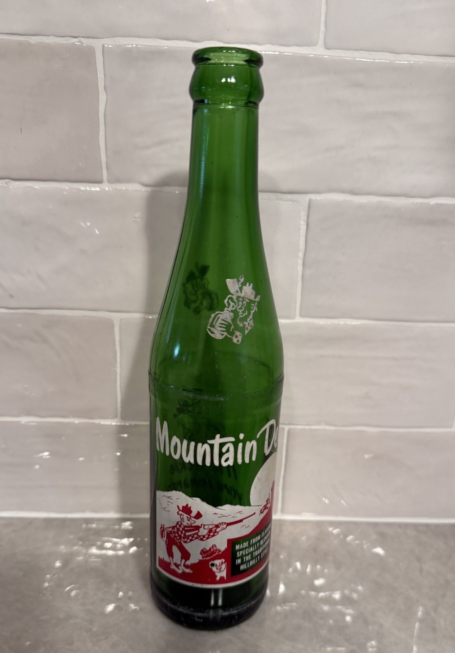 Mountain Dew Hillbilly Vintage Soda Bottle 10 oz "it'll tickle yore innards"