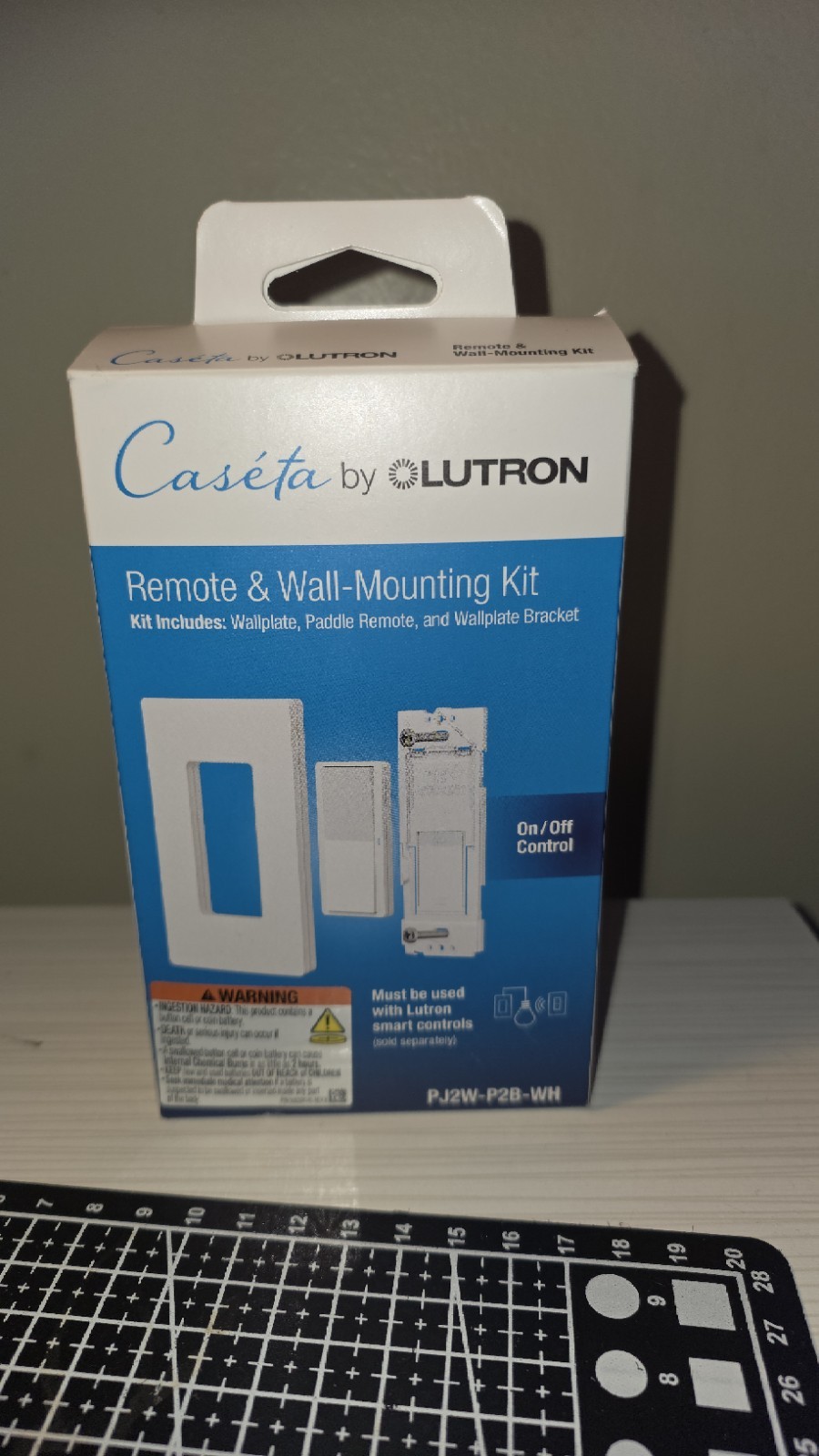 Lutron Caseta Paddle Remote PJ2W-P2B-WH-R with Wall Mount Kit – White