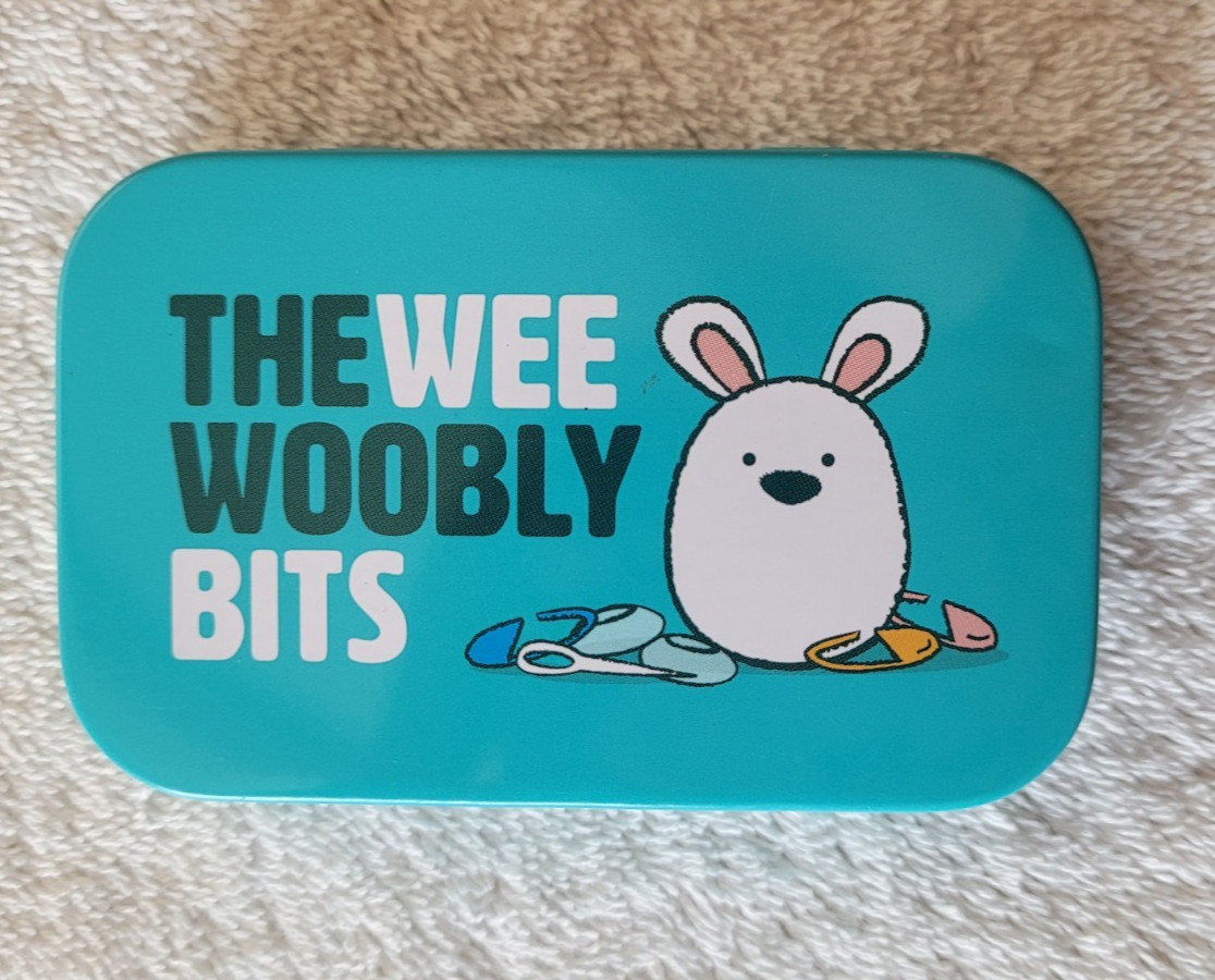 Preowned  Wooble Wee Woobly Bits Tin