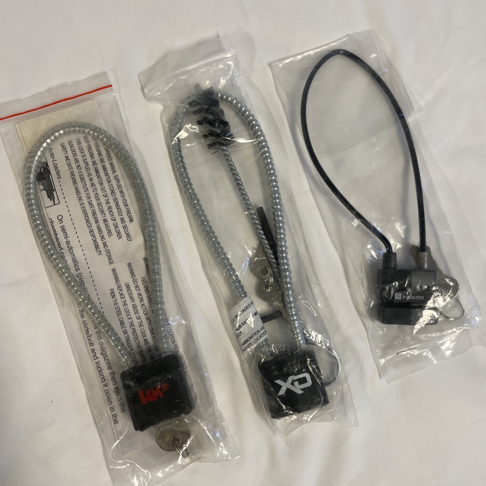 Bundle. 3 NEW Pistol Cable Locks. HK , XD, And Franzen. Never Used. 2 Keys Each.