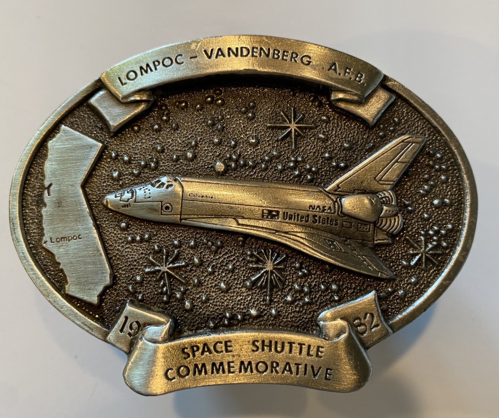 1982 commemorative belt buckle celebrating the early era of NASA