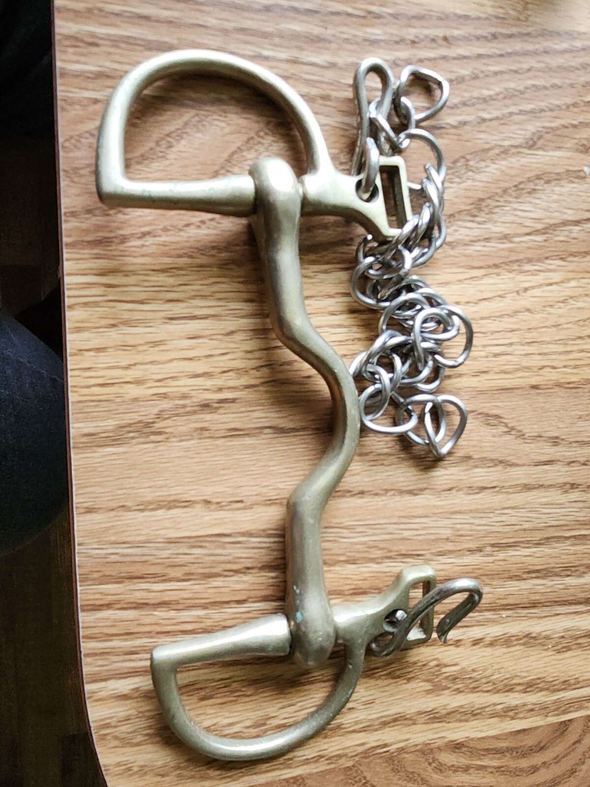 Brass colored D Ring Low Port English 5 inch Bit with chin strap