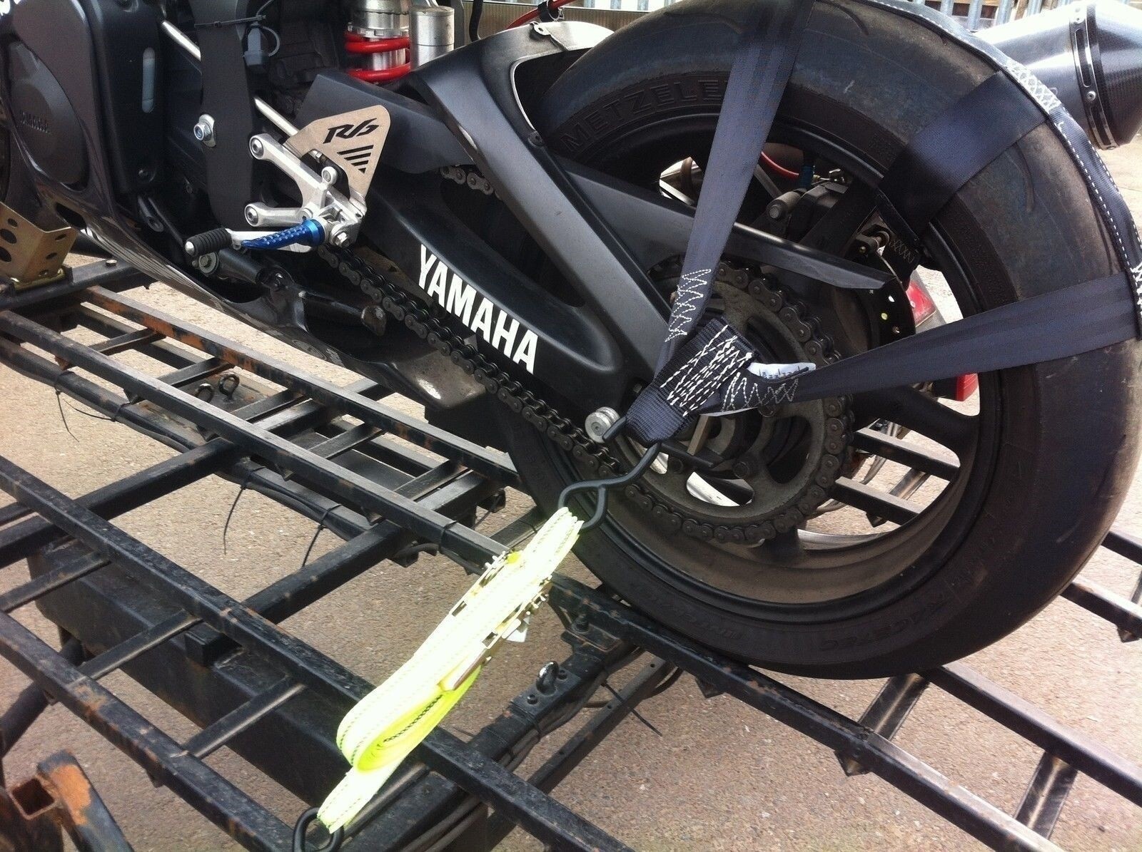 Rear wheel tie-down strap