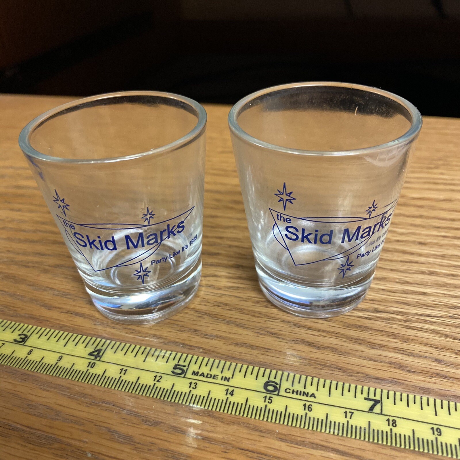 (2) The Skid Marks Shot Glasses - One with small crack