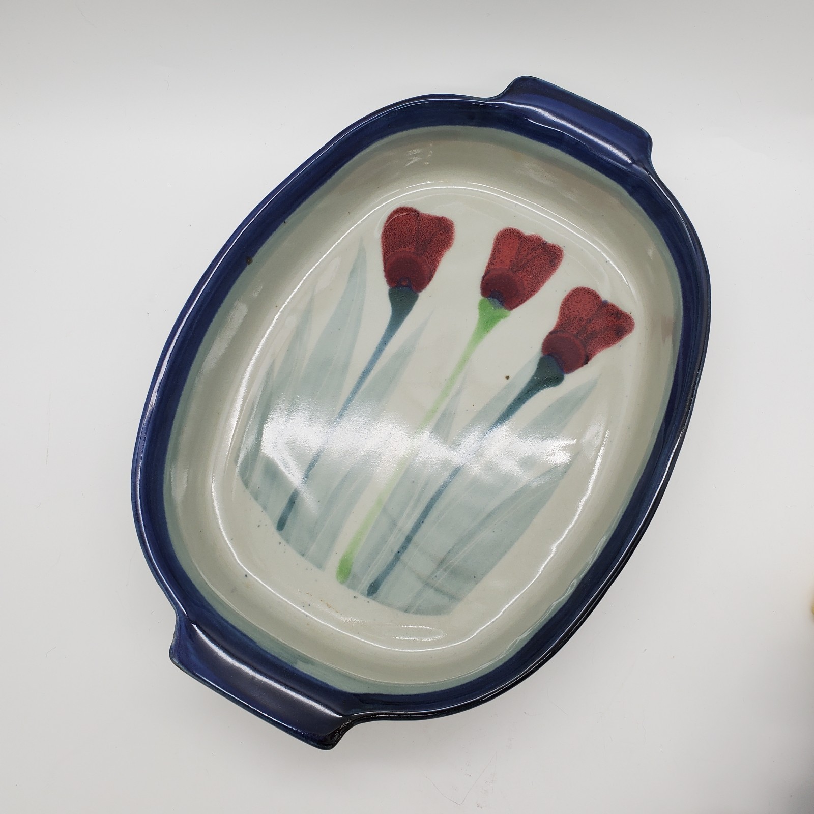 Ceramic heat fired serving dish with tulip decoration