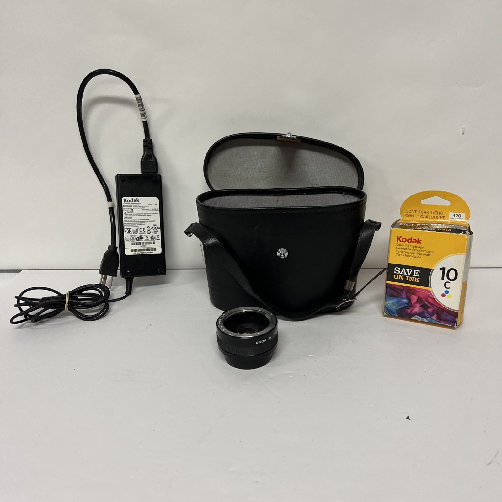 vintage camera parts lot Including a Case, Old Film, Lens, and Kodak Cord