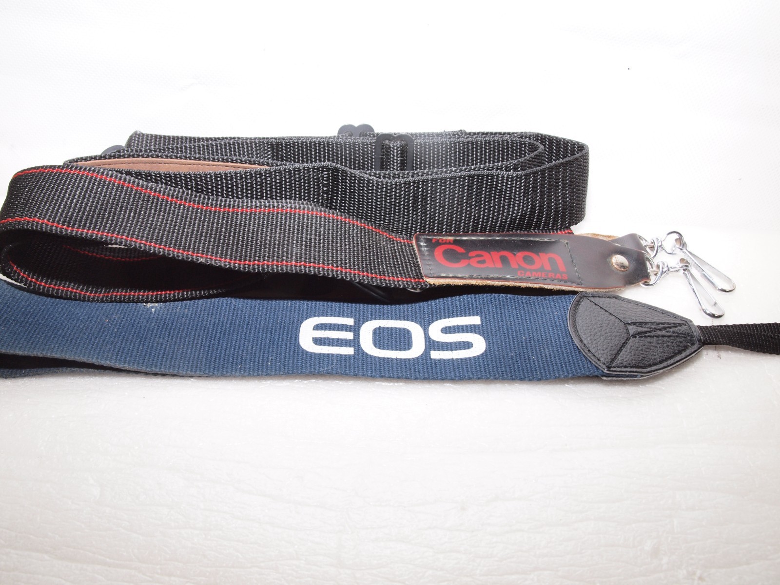 Canon camera straps- 1 new in package includes Canon EOS wide strap.